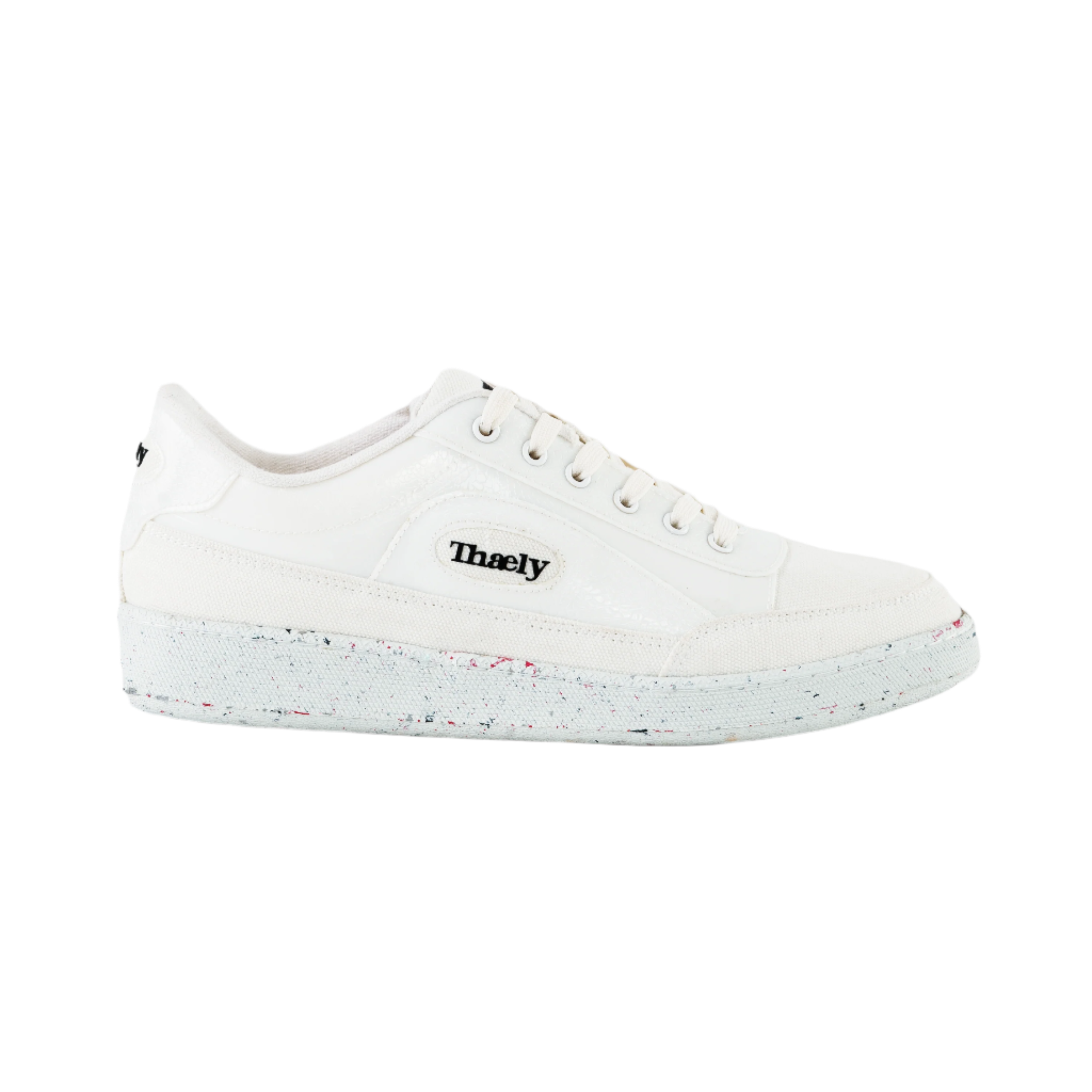 White vegan leather streetwear sneaker with speckled sole, side logo, and designer style