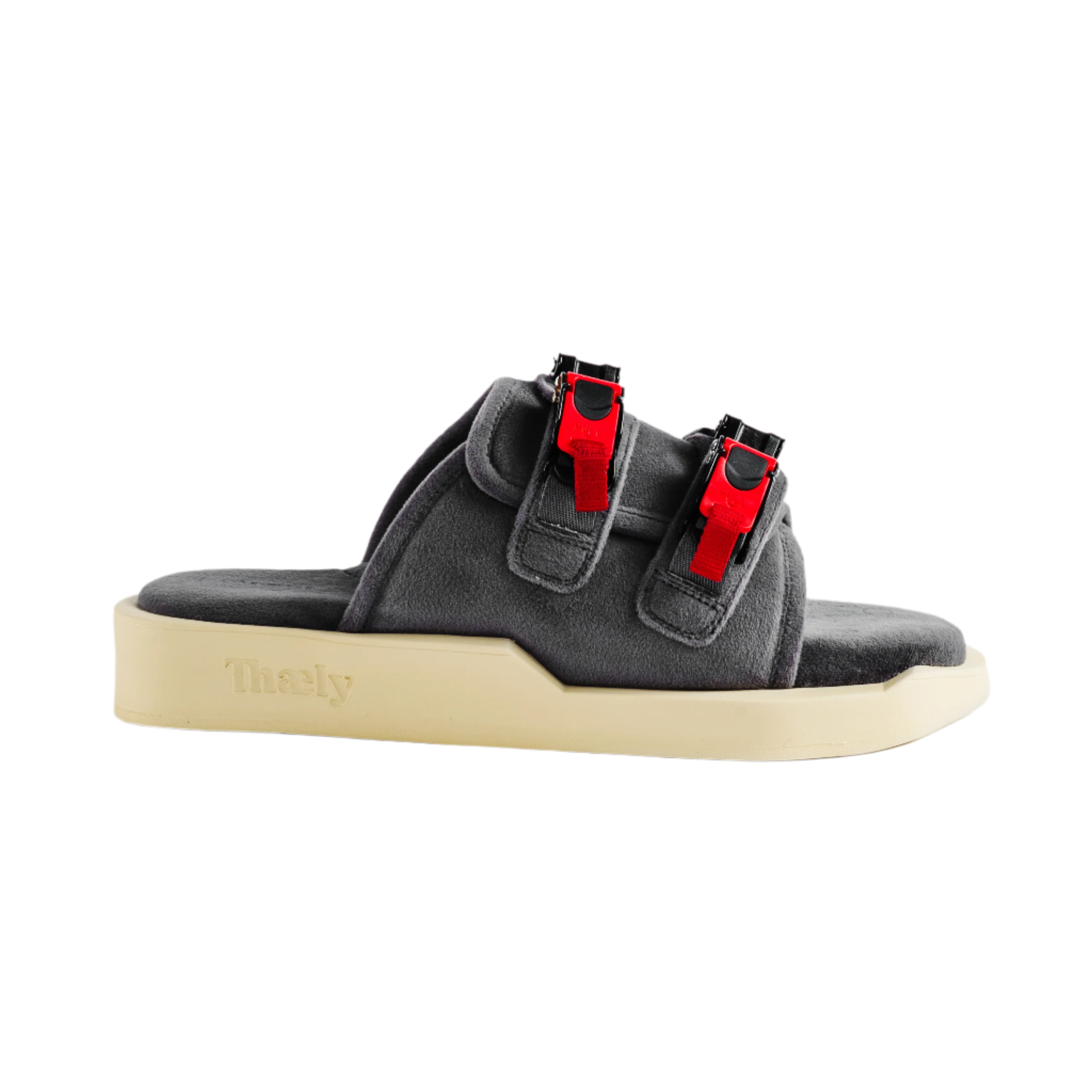 Gray streetwear sandal with red buckle straps and thick beige sole on white background