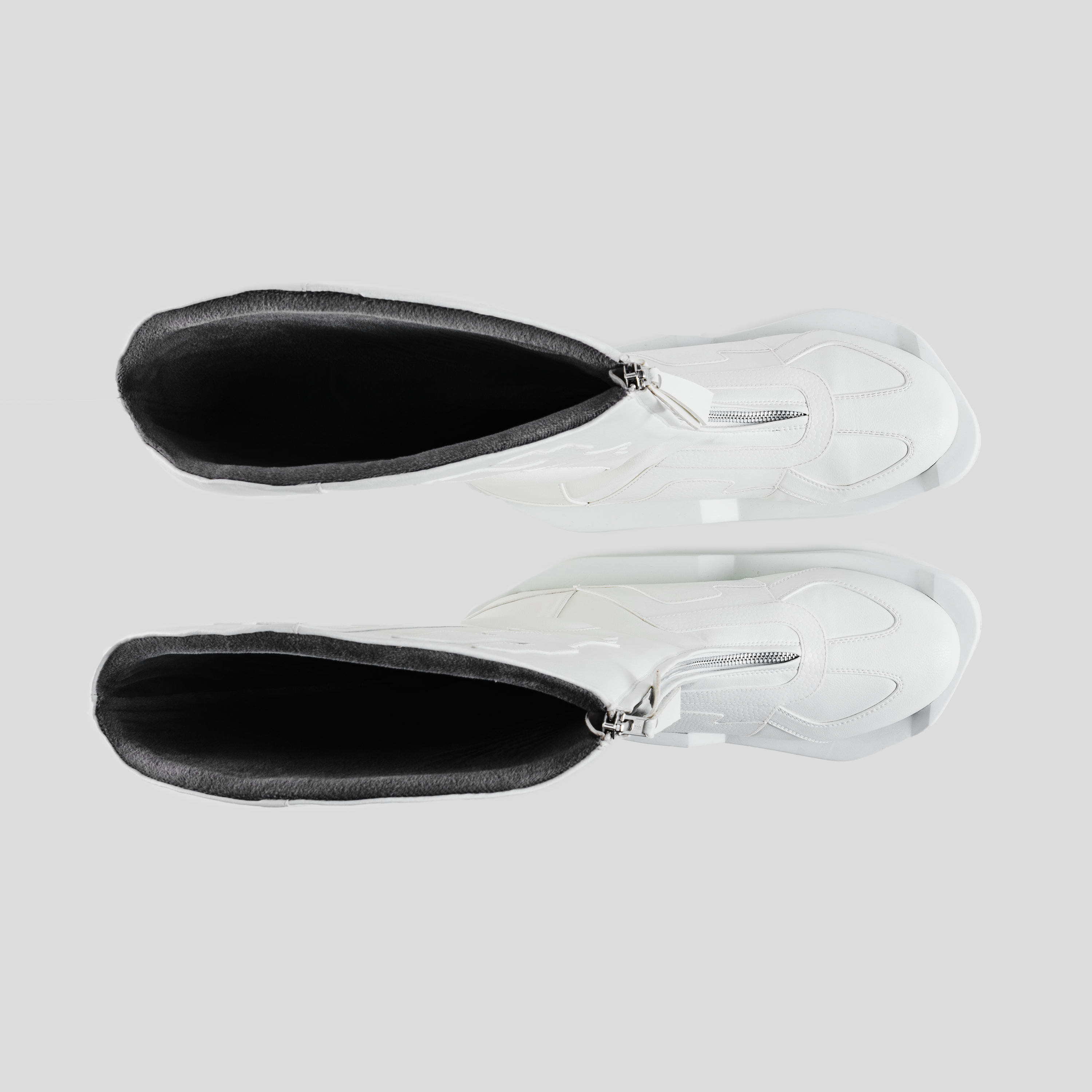 Top view of white designer high-top sneakers with side zippers and black inner lining