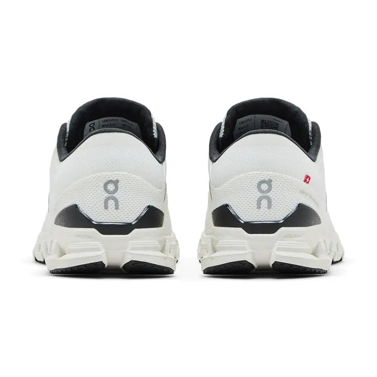 Rear view of white and black On running sneakers with mesh upper and CloudTec sole