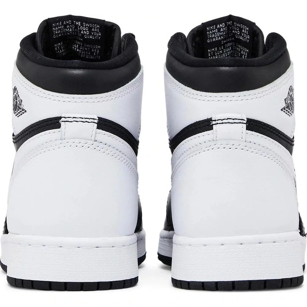 Back view of black and white high-top sneakers with leather upper and contrast stitching