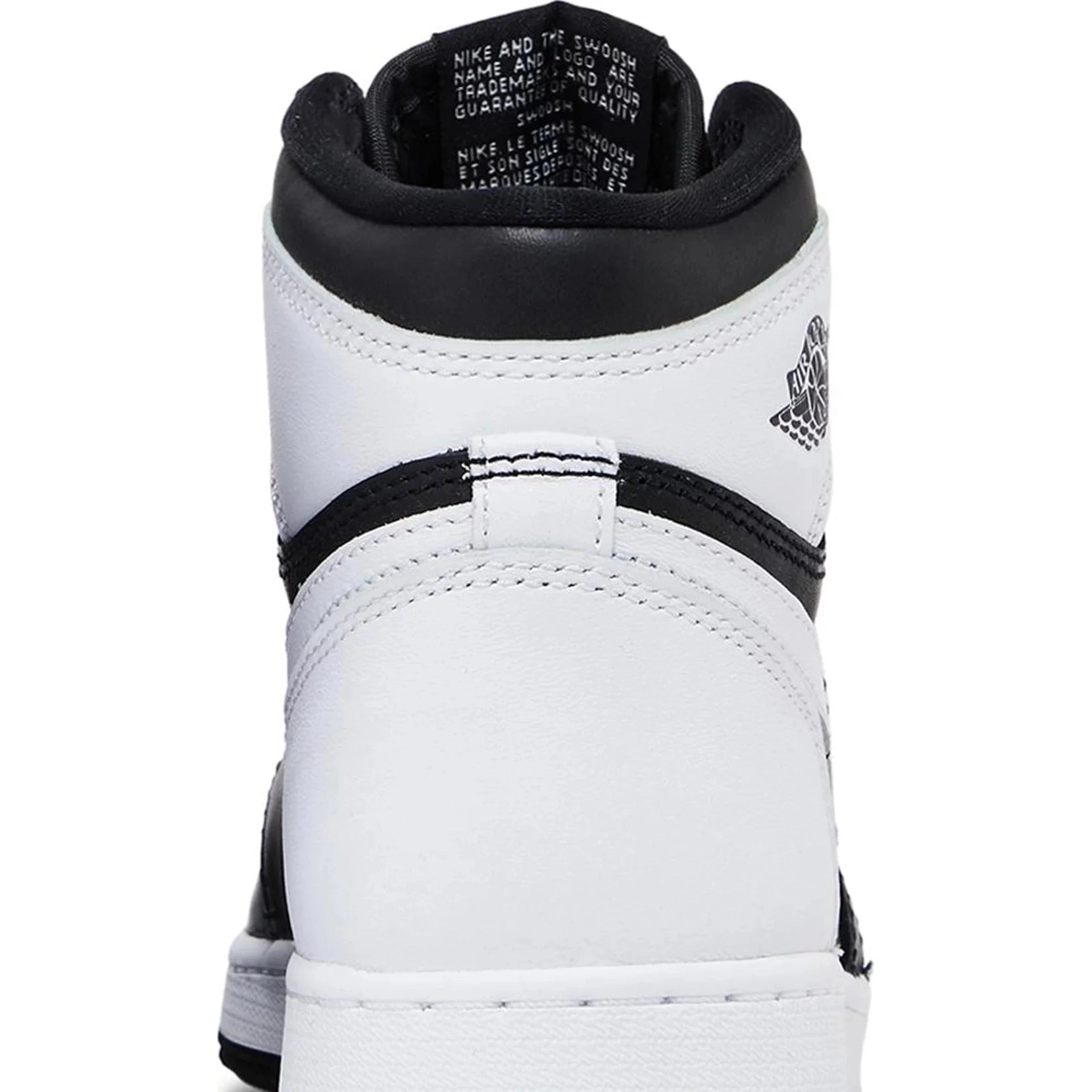 Close-up rear view of black and white high-top sneaker with leather upper and logo detail