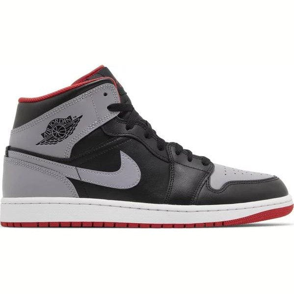 Black and grey Air Jordan 1 Mid sneaker with red accents, side profile view