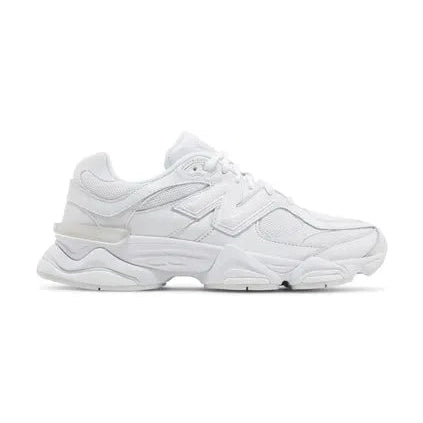 All-white streetwear sneaker with chunky sole and layered design, side profile view