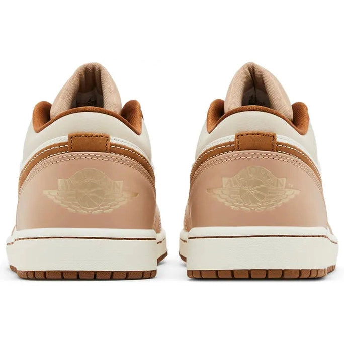Back view of beige and tan Air Jordan 1 Low sneakers with wing logo detailing