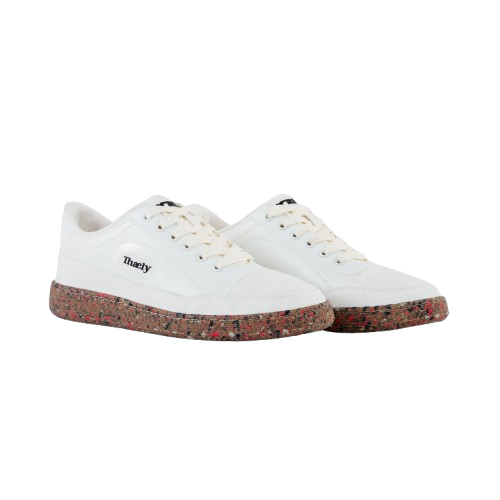 White low-top streetwear sneakers with speckled brown sole on white background