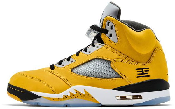 Yellow high-top sneaker with black and white accents on a white background