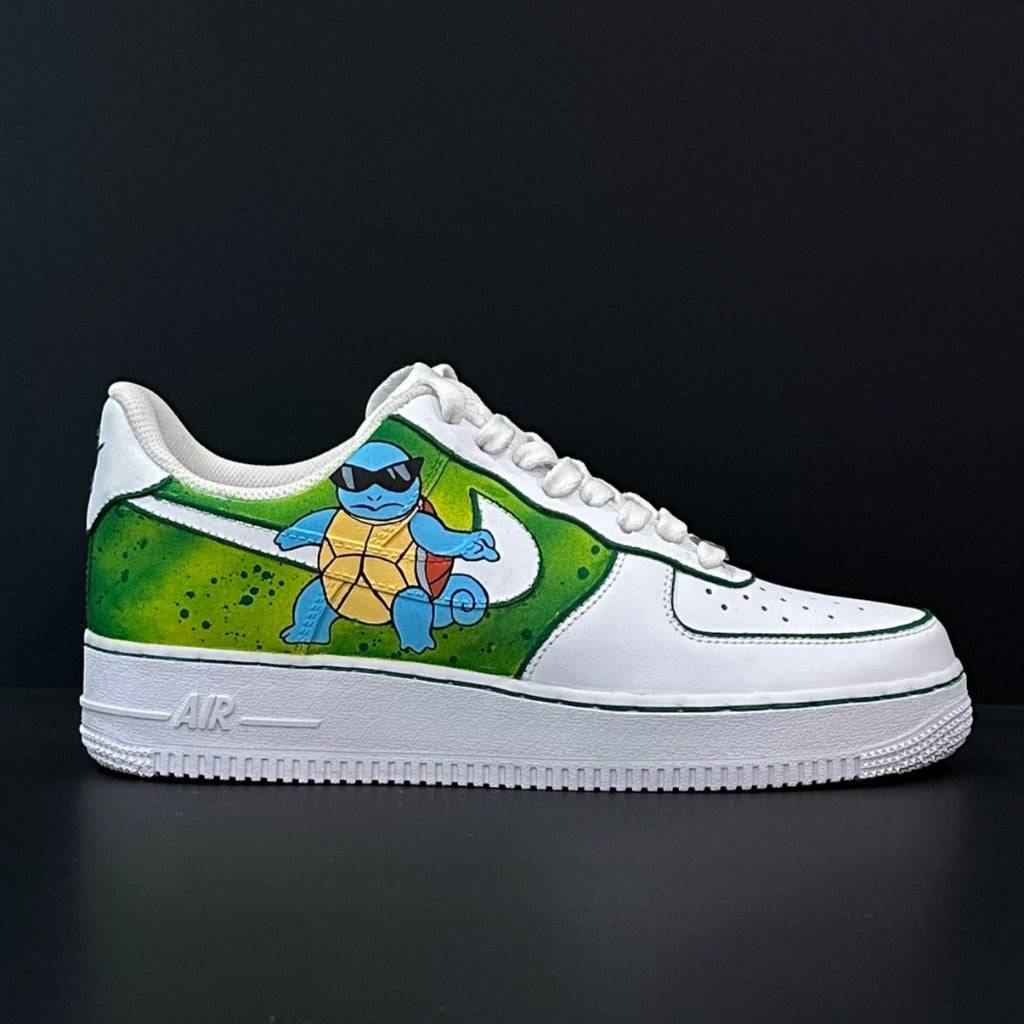 Custom white sneaker with green accents featuring a cartoon turtle graphic on the side.