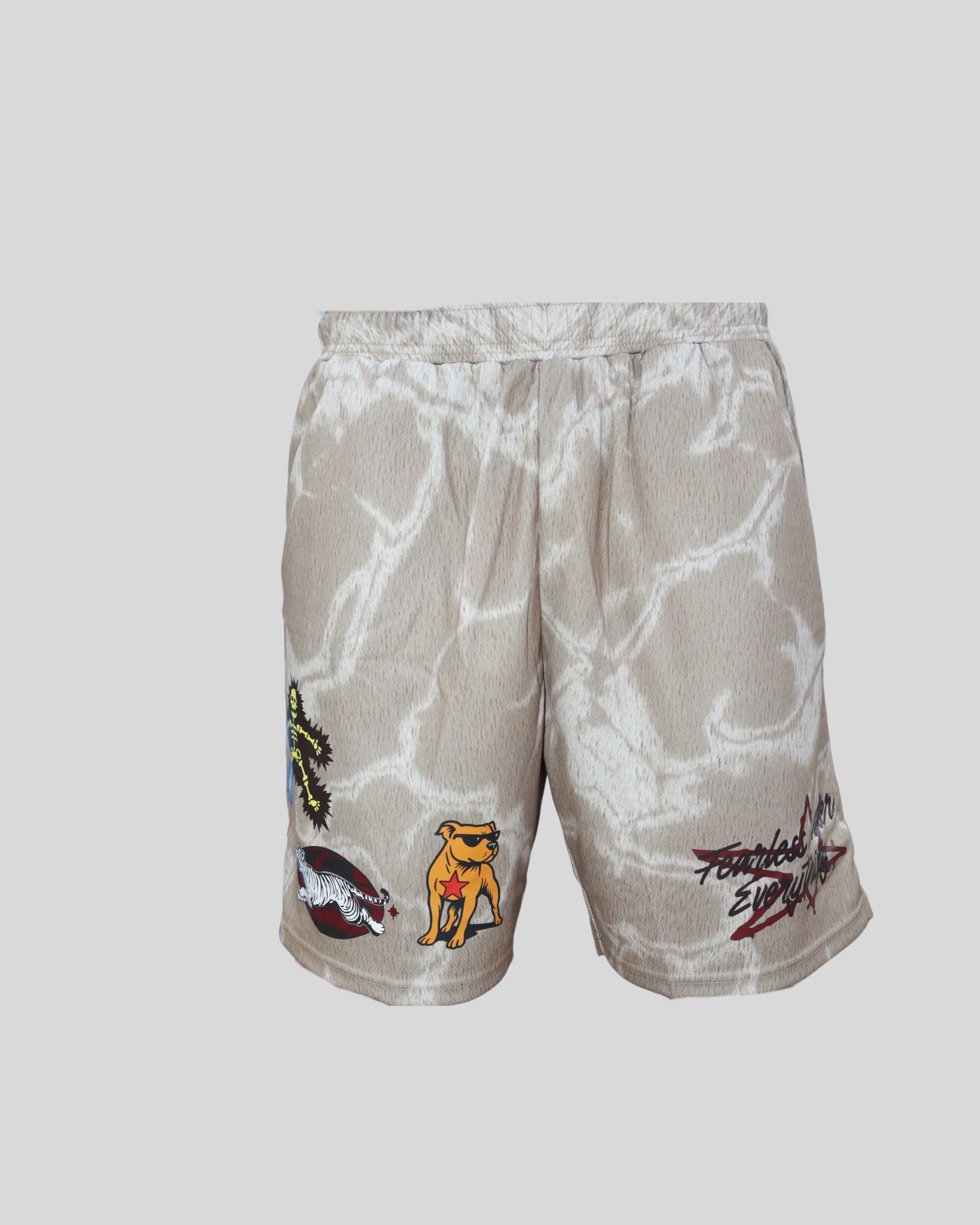 Close-up of beige Fearless Under Everything Mad-Max Shorts with graphic embroidery and printed details.