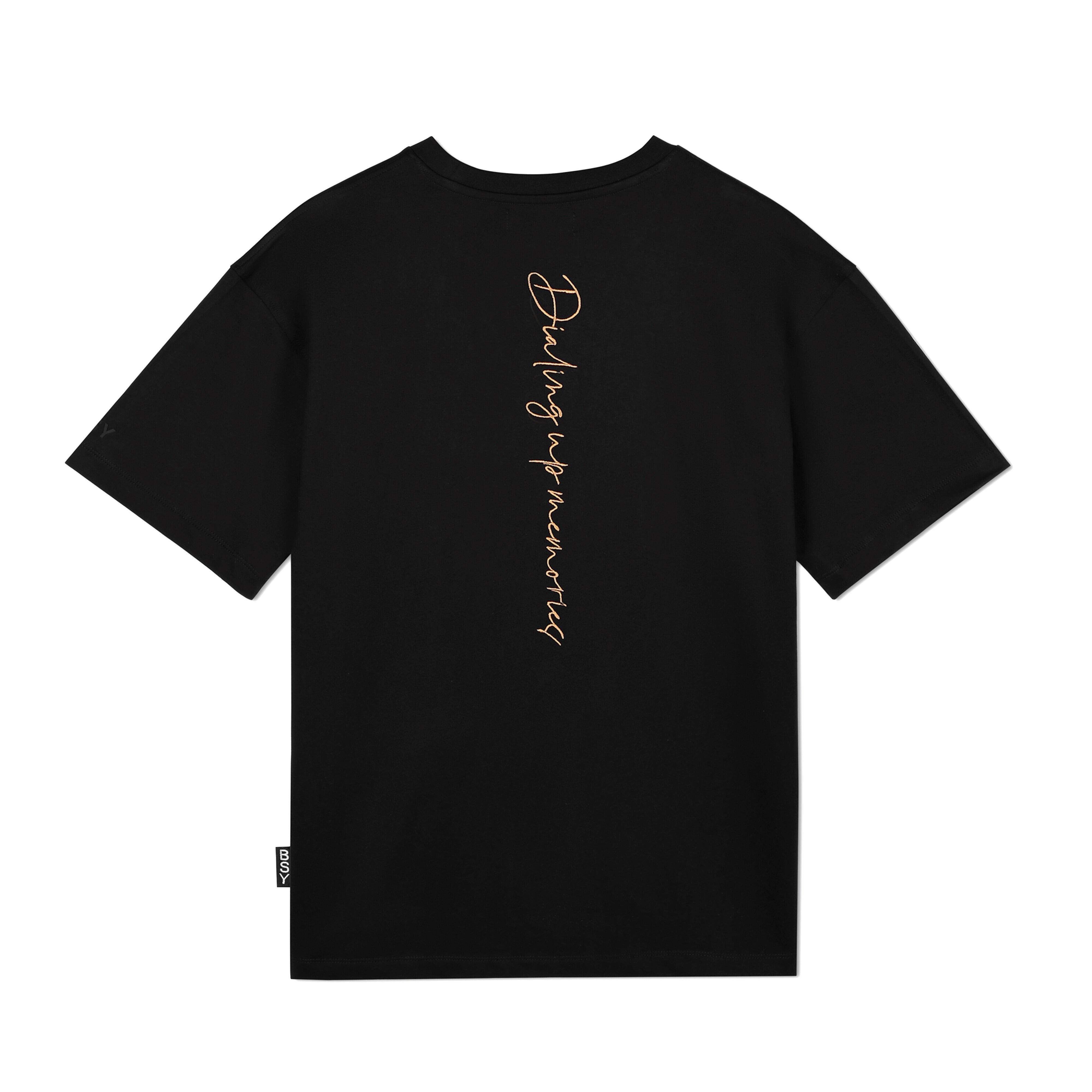 Black streetwear t-shirt with vertical gold script reading 'Dialing up memories' on the back