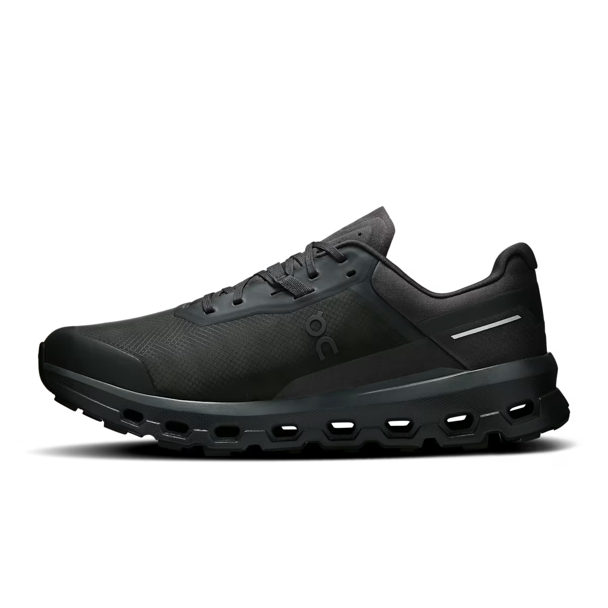 Black On running shoe with mesh upper and signature ventilation sole, side view on white background