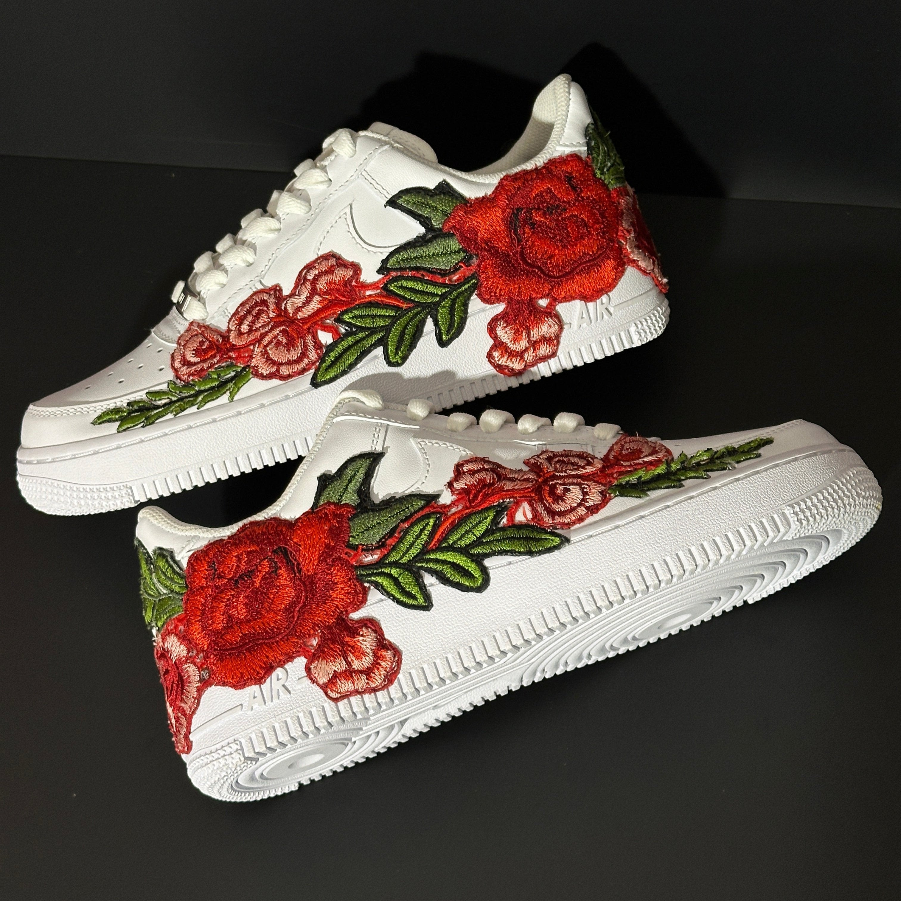 White sneakers with bold red and pink rose embroidery, streetwear custom design