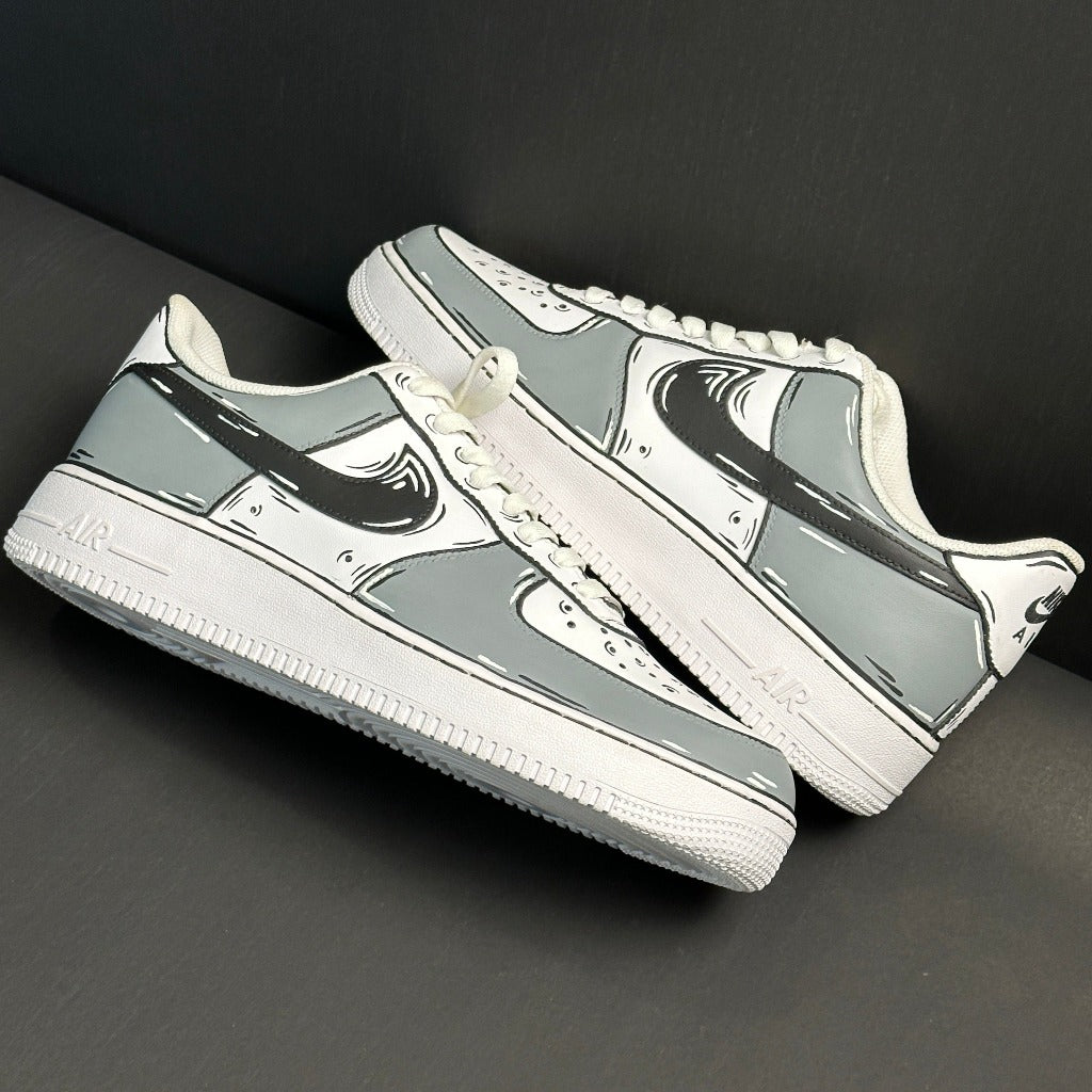 Gray and white streetwear sneakers with cartoon-inspired outlines, low-top design on dark background