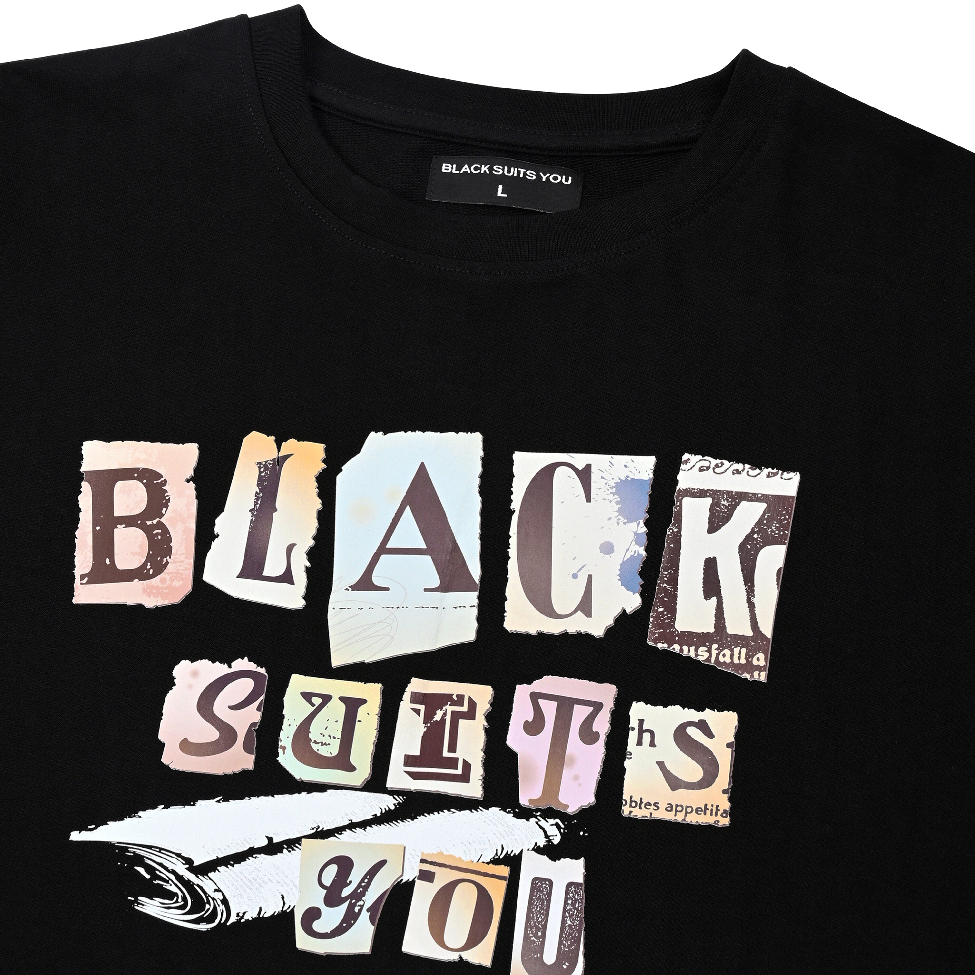 Black streetwear t-shirt with 'BLACK SUITS YOU' ransom-style graphic print on front.