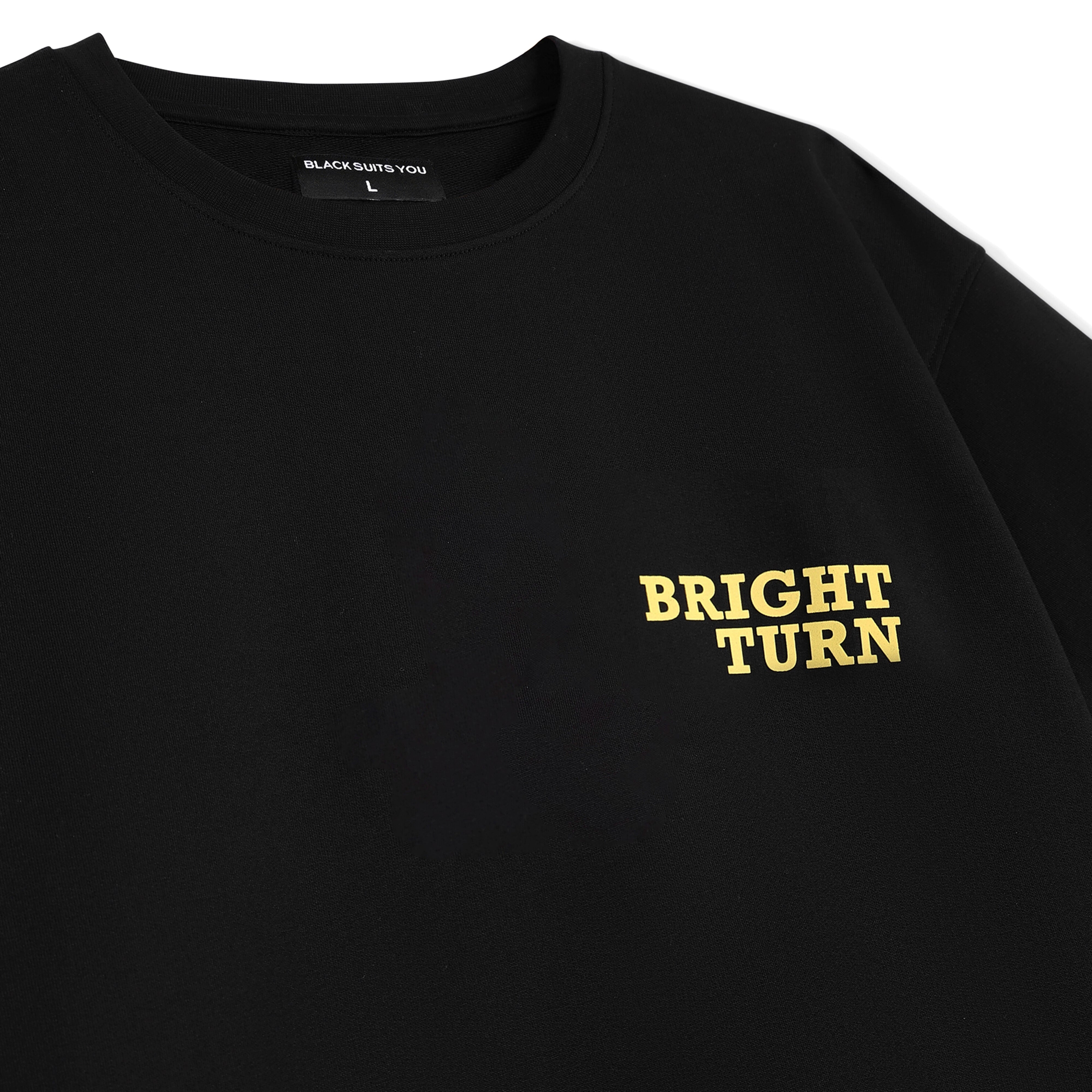 Black streetwear t-shirt with yellow 'BRIGHT TURN' text on chest, minimalist design
