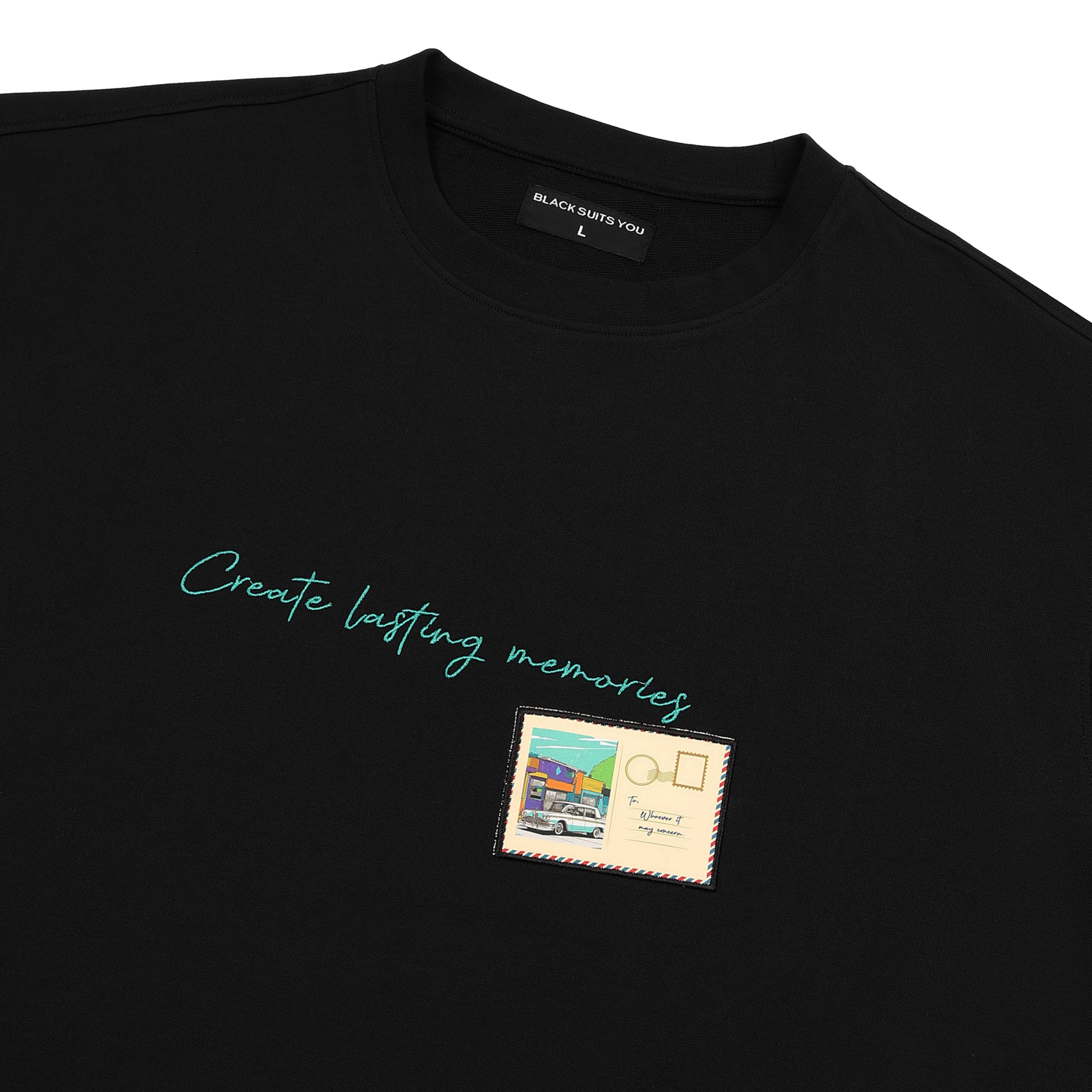 Black graphic streetwear t-shirt with 'Create lasting memories' text and postcard print