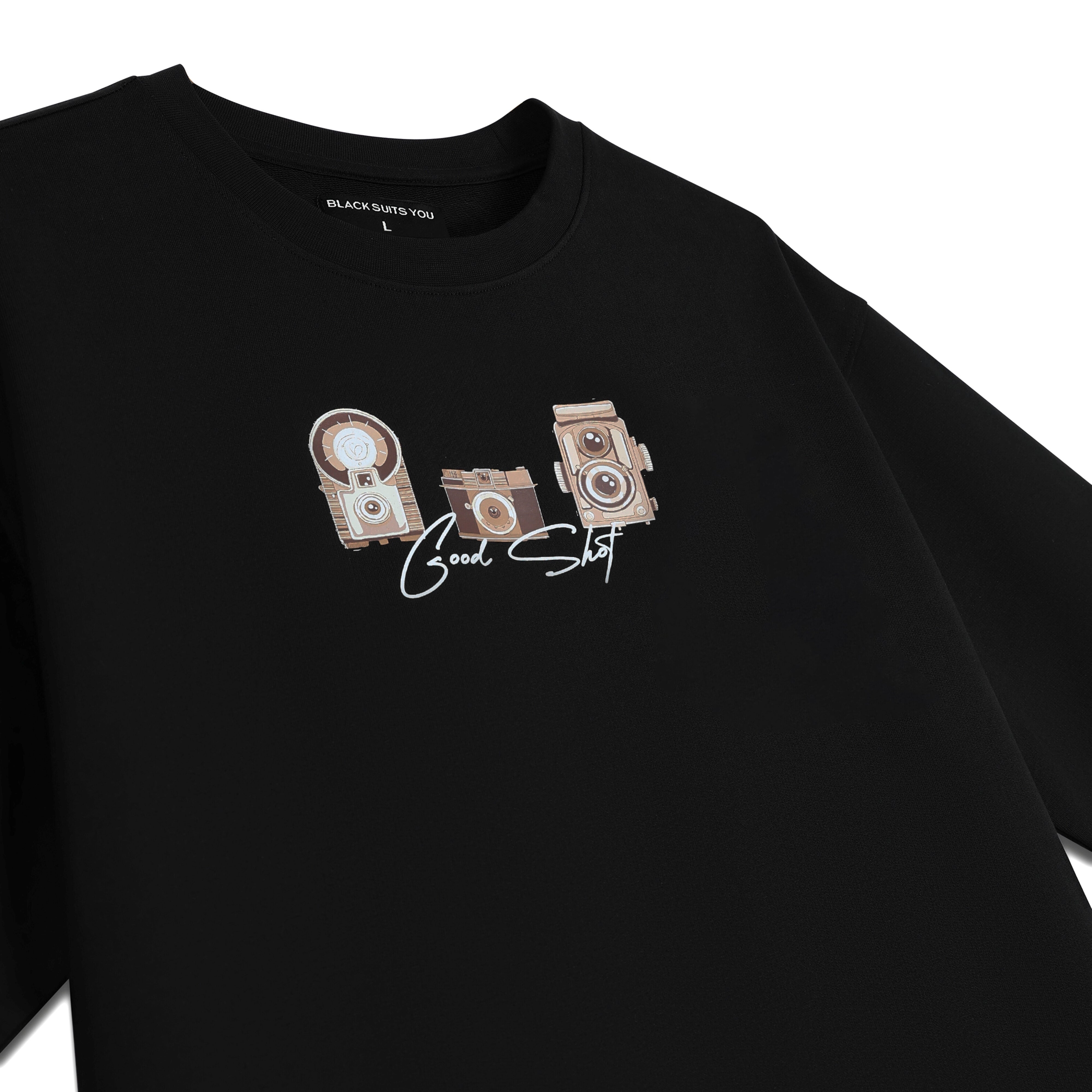 Black streetwear t-shirt with vintage camera graphics and 'Good Shot' text on front