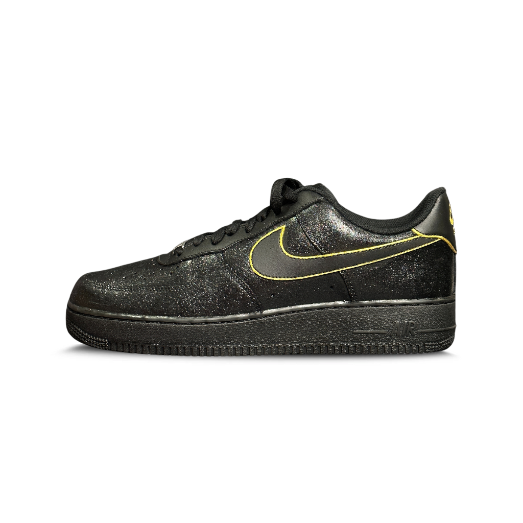 Black glitter low-top sneaker with yellow trim and outlined swoosh, luxury streetwear shoe