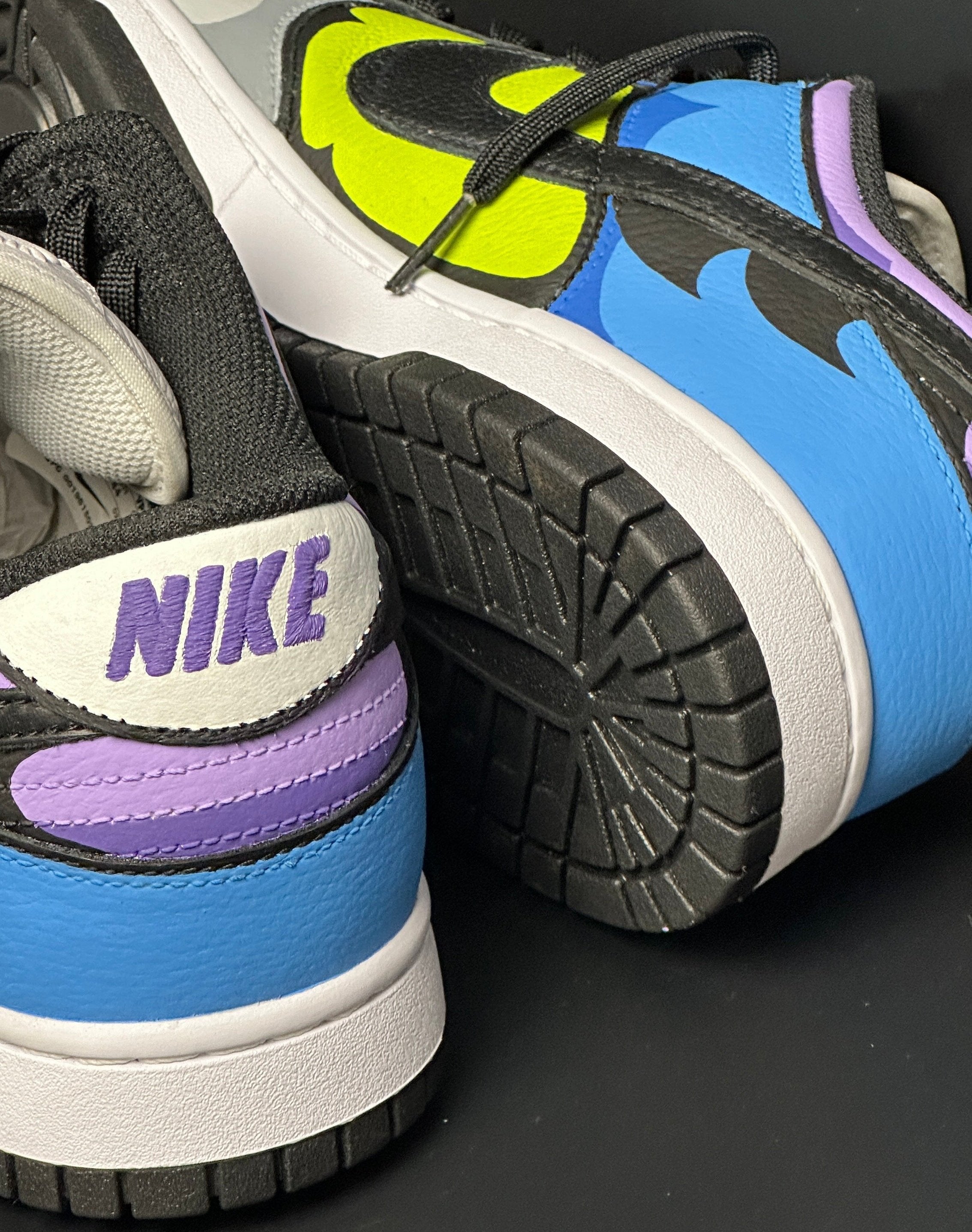 Close-up of colorful Nike sneakers with blue, yellow, purple, and black accents