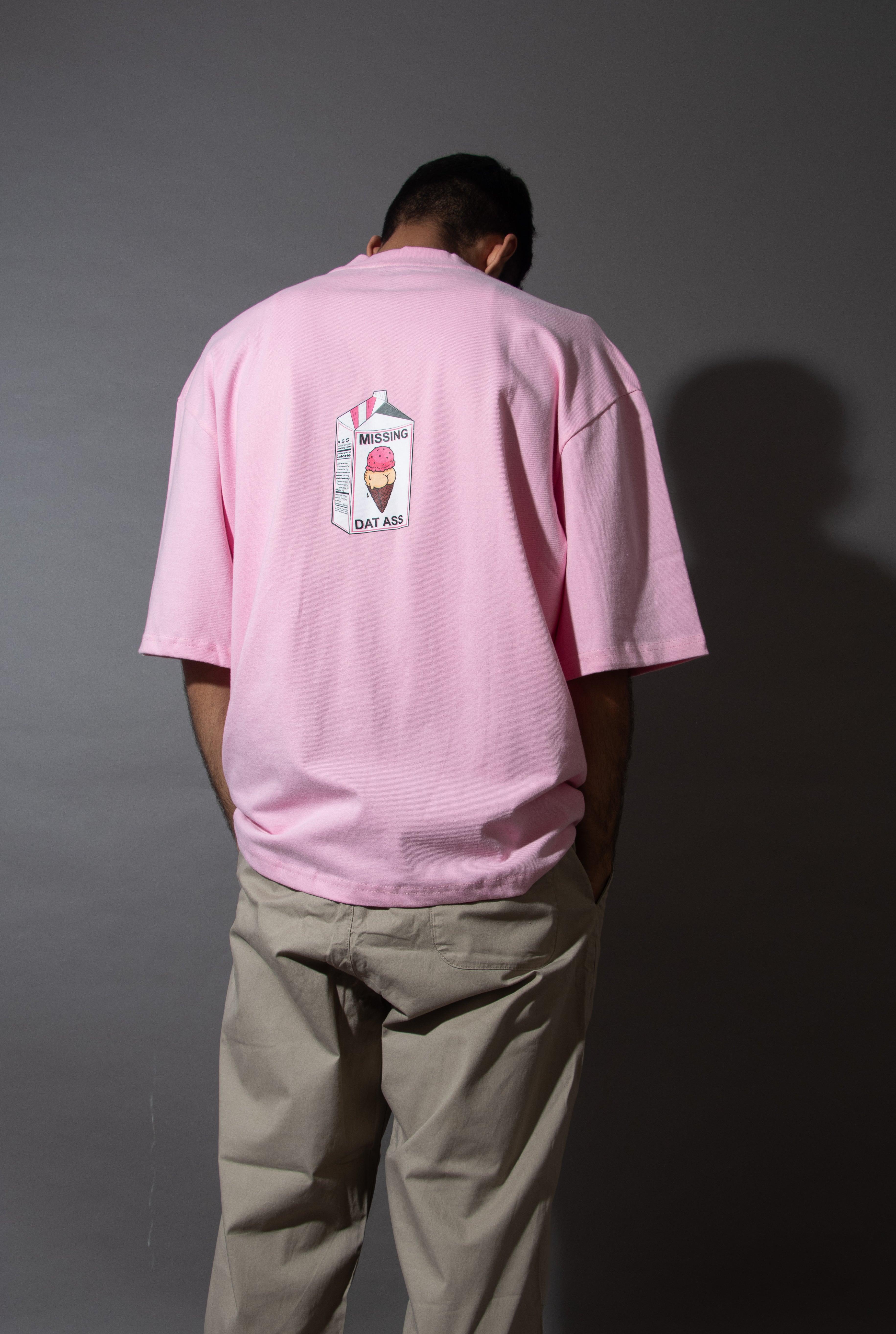 Man wearing pink streetwear t-shirt with cartoon milk carton graphic on the back