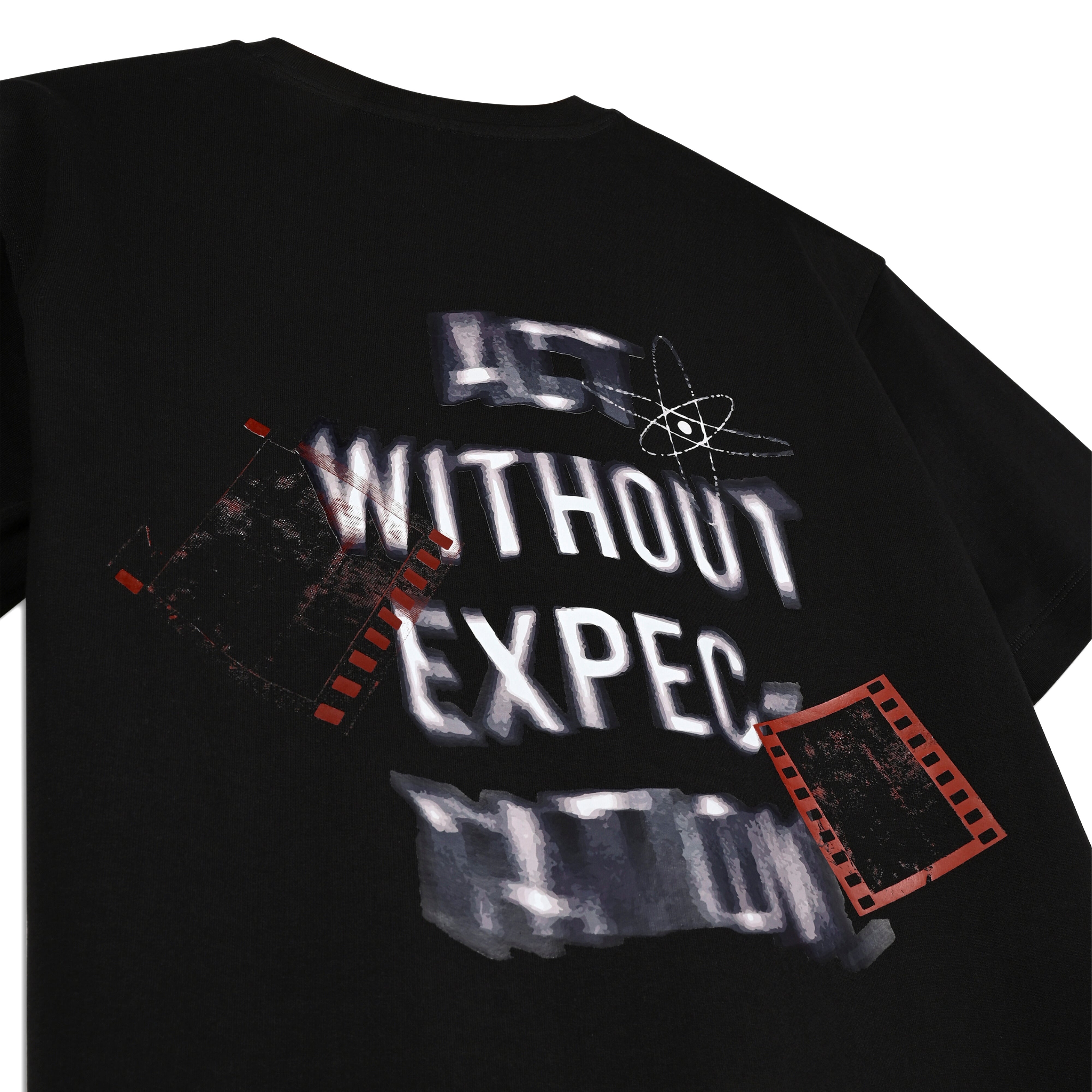 Black streetwear t-shirt with 'Act Without Expectation' graphic, red film strips, and atom design
