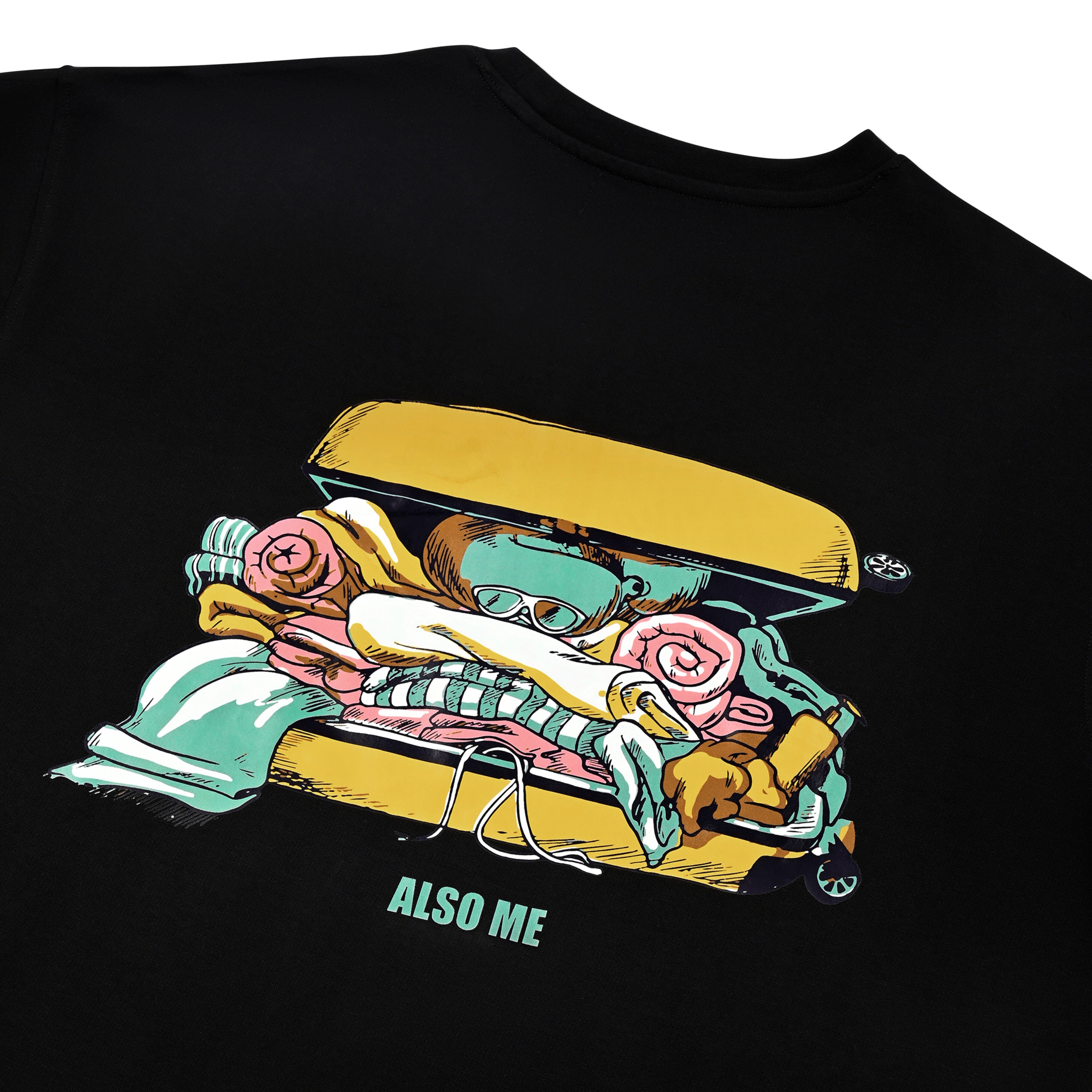 Black streetwear shirt with colorful suitcase cartoon graphic and 'ALSO ME' text