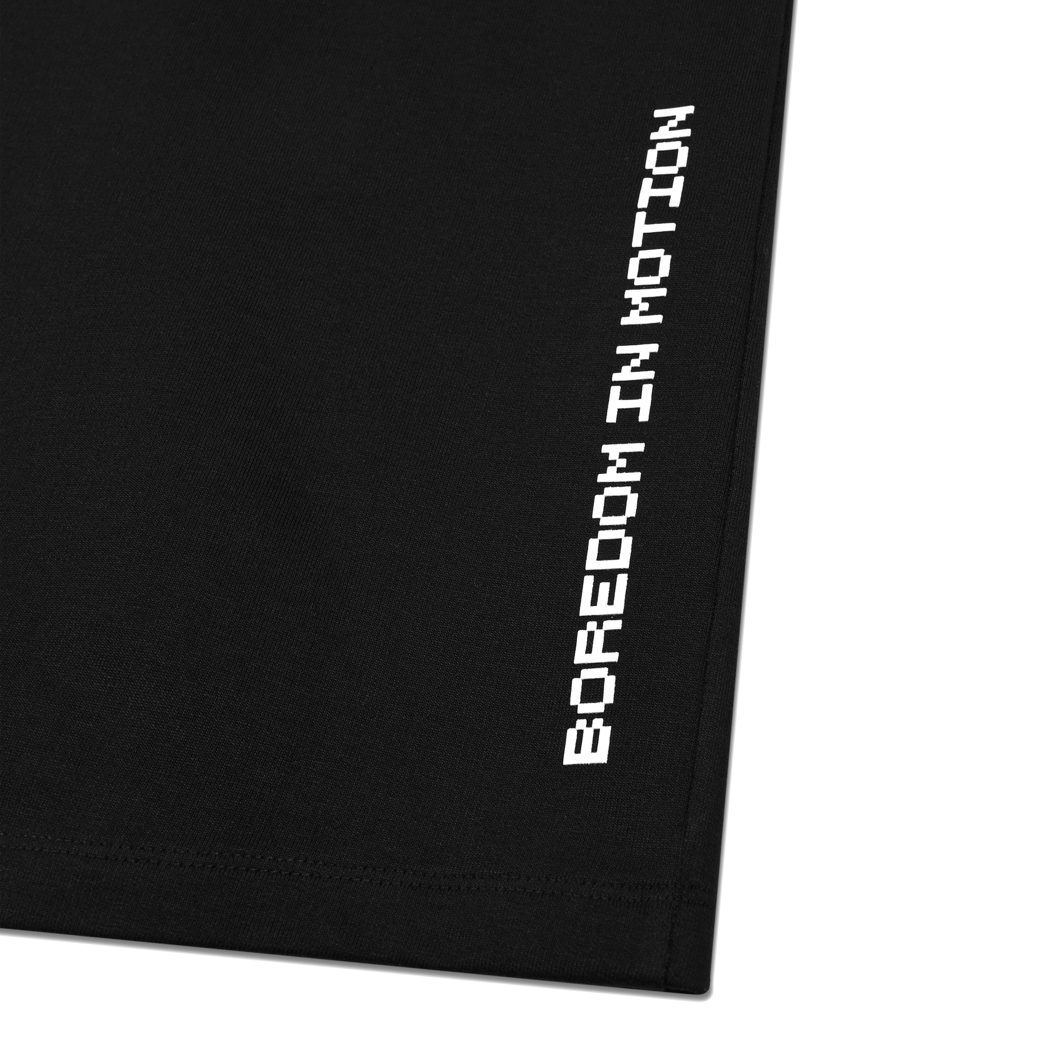 Black streetwear t-shirt with white pixel text graphic reading 'Boredom In Motion' on hem