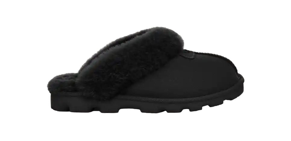 Black slipper with fluffy interior on a white background