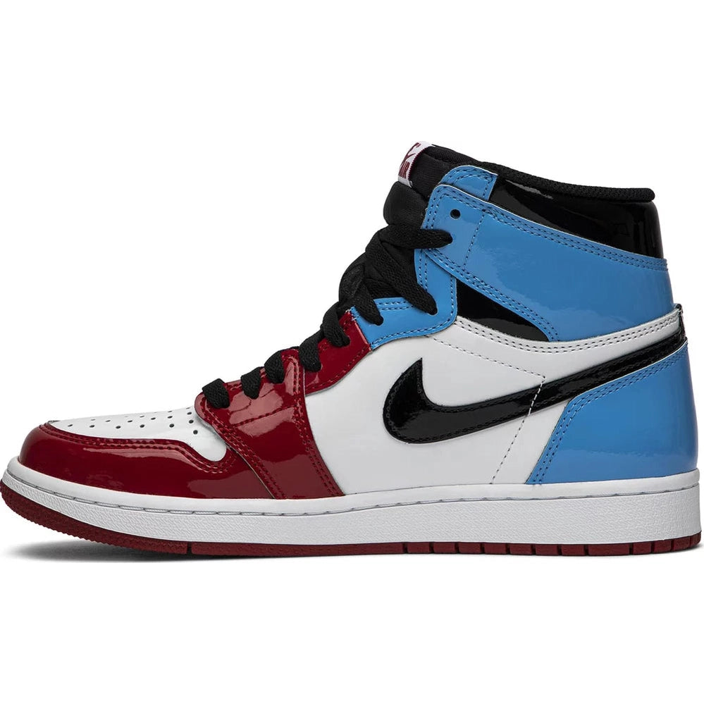 High-top sneaker with patent leather, red, blue, white panels and black Nike Swoosh logo.