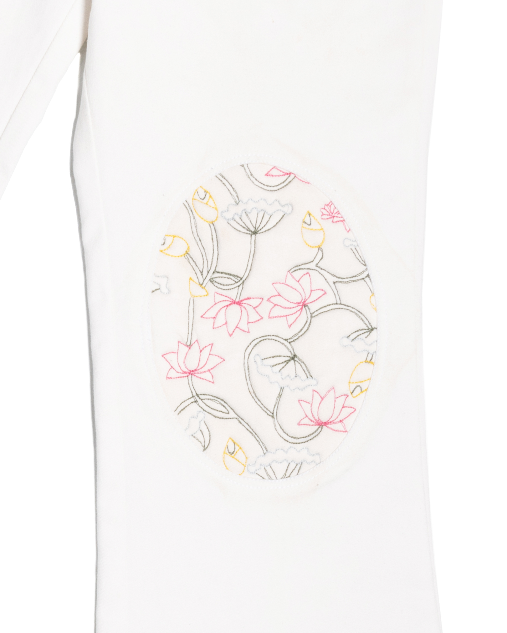 White sleeve with floral embroidered patch featuring pink and yellow lotus flowers