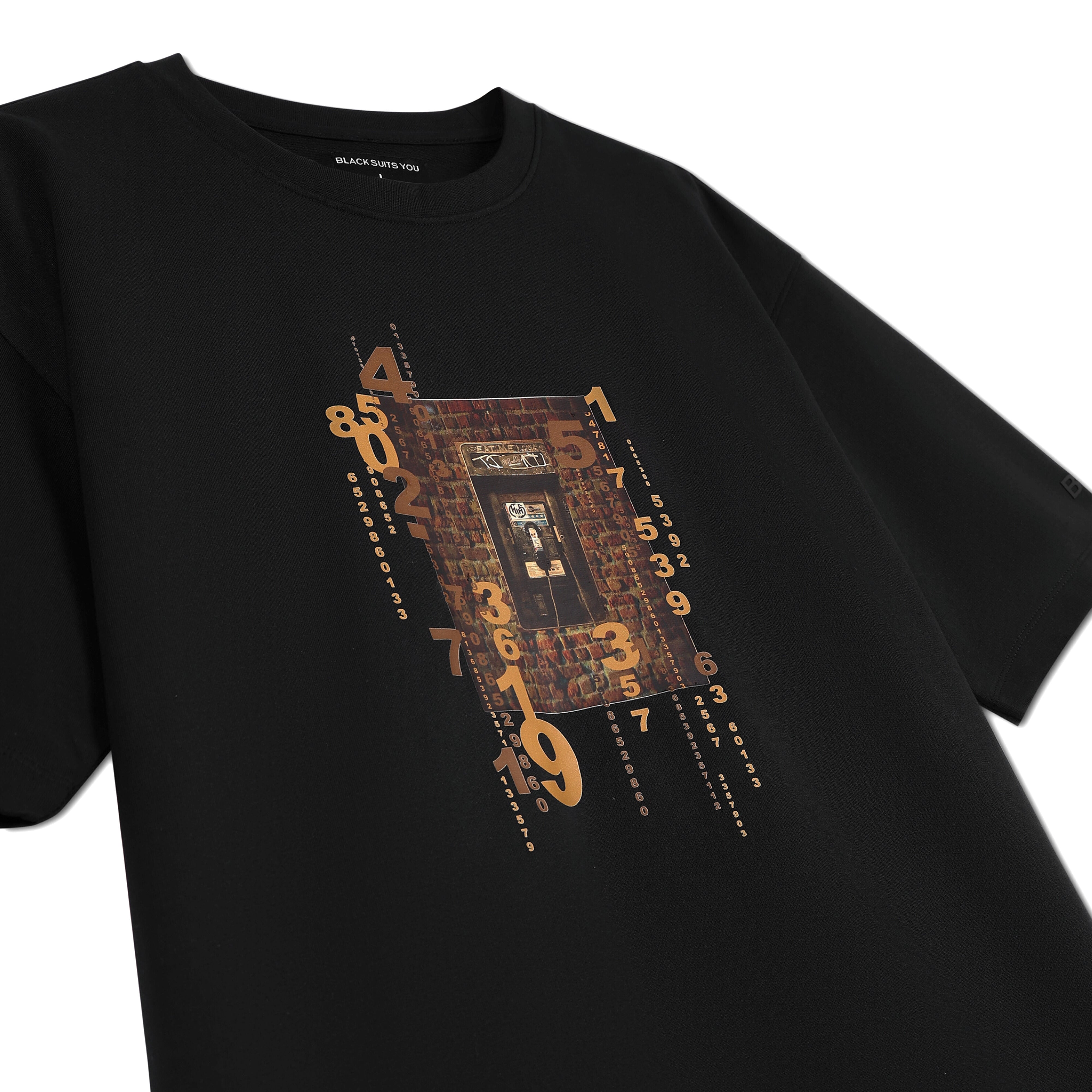 Black streetwear t-shirt with vintage brick door and bold orange number graphic print.