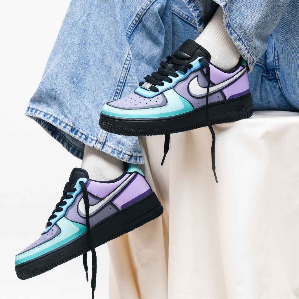 Stylish pastel colorblock sneakers with black sole, worn with light blue jeans and white socks