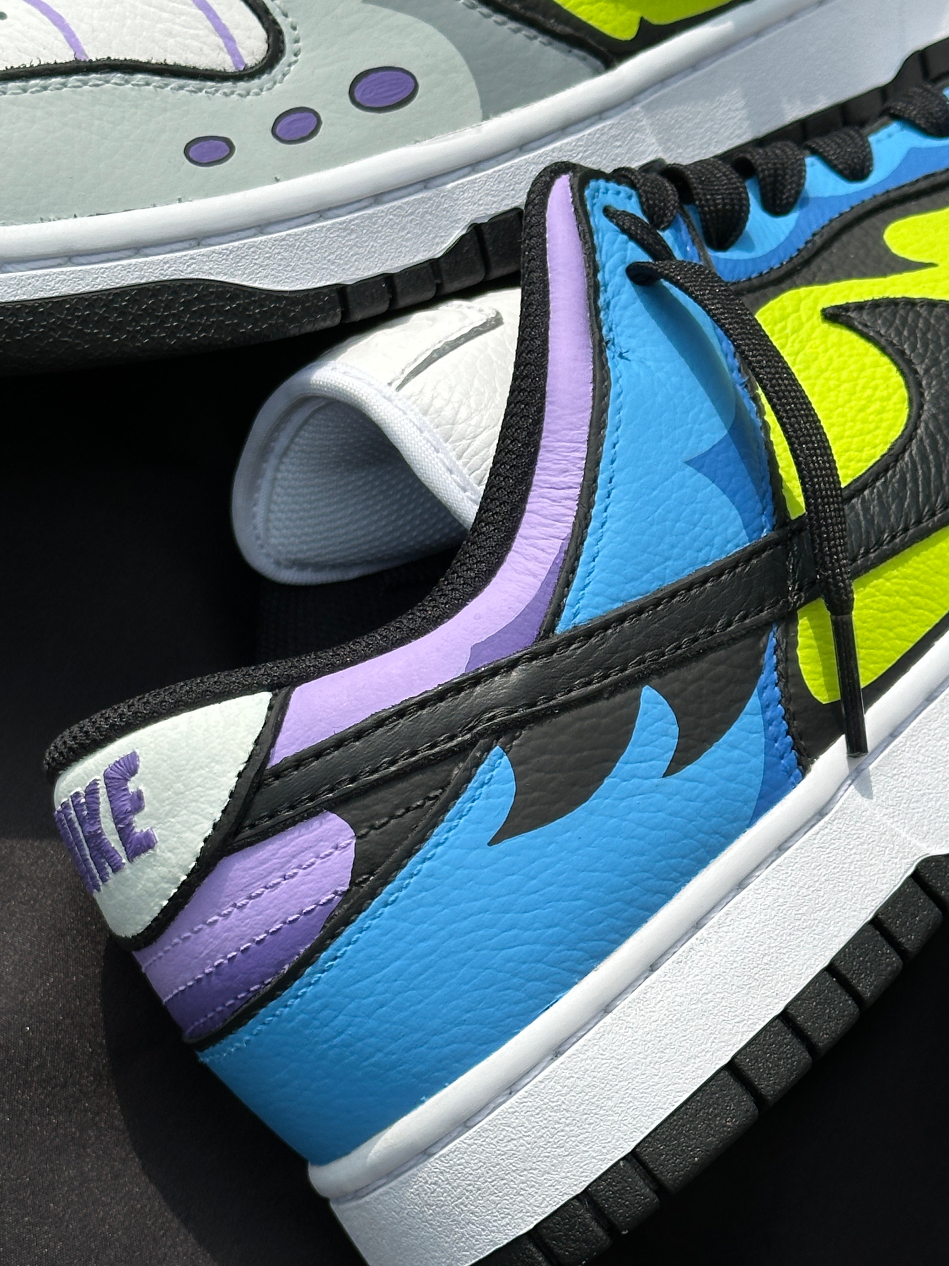 Closeup of colorful leather streetwear sneakers with neon green, blue, purple, and black accents