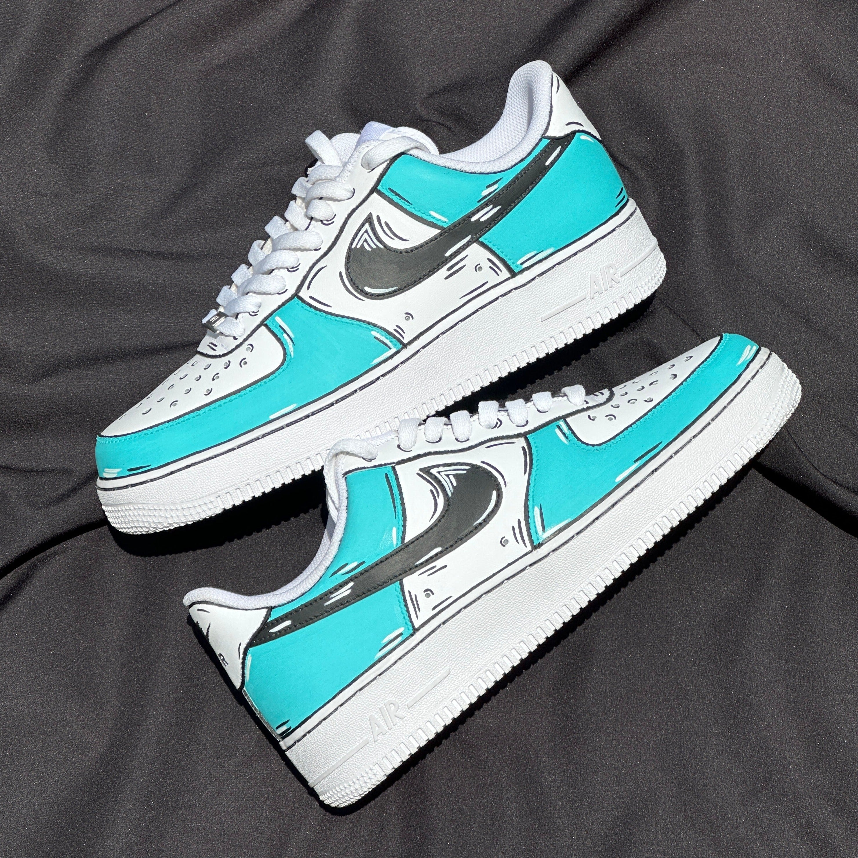 Custom turquoise and white streetwear sneakers with black swoosh on black fabric