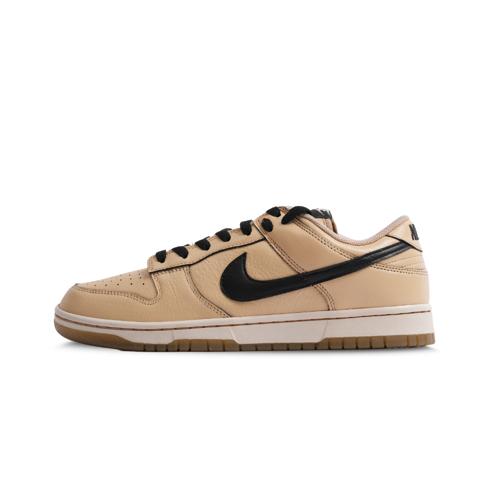 Tan and black Nike Dunk Low leather sneaker with gum sole, streetwear shoe on white background
