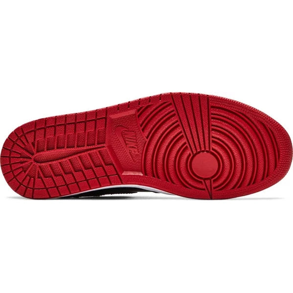 Red outsole of a Nike Air Jordan 1 sneaker with classic pivot design, streetwear shoe