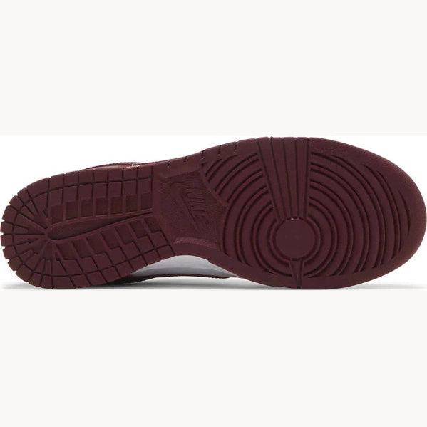 Maroon rubber sole of a Nike sneaker, streetwear and limited edition footwear