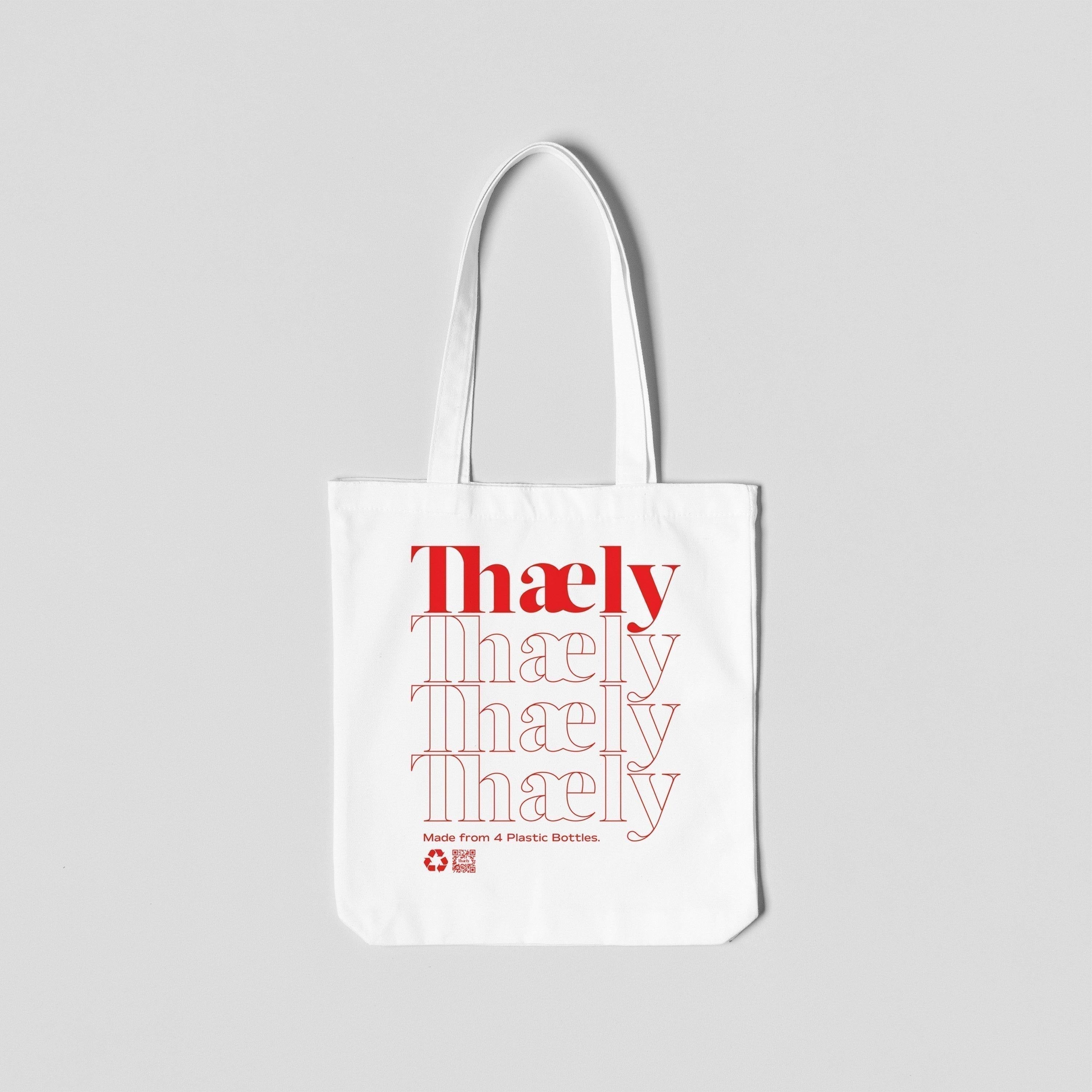 White eco-friendly tote bag with red Thaely logo and recycled plastic bottle text