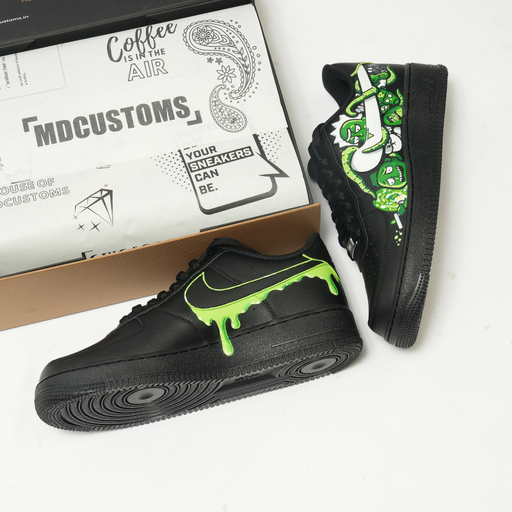 Custom black sneakers with neon green drip Swoosh and cartoon graffiti art design.