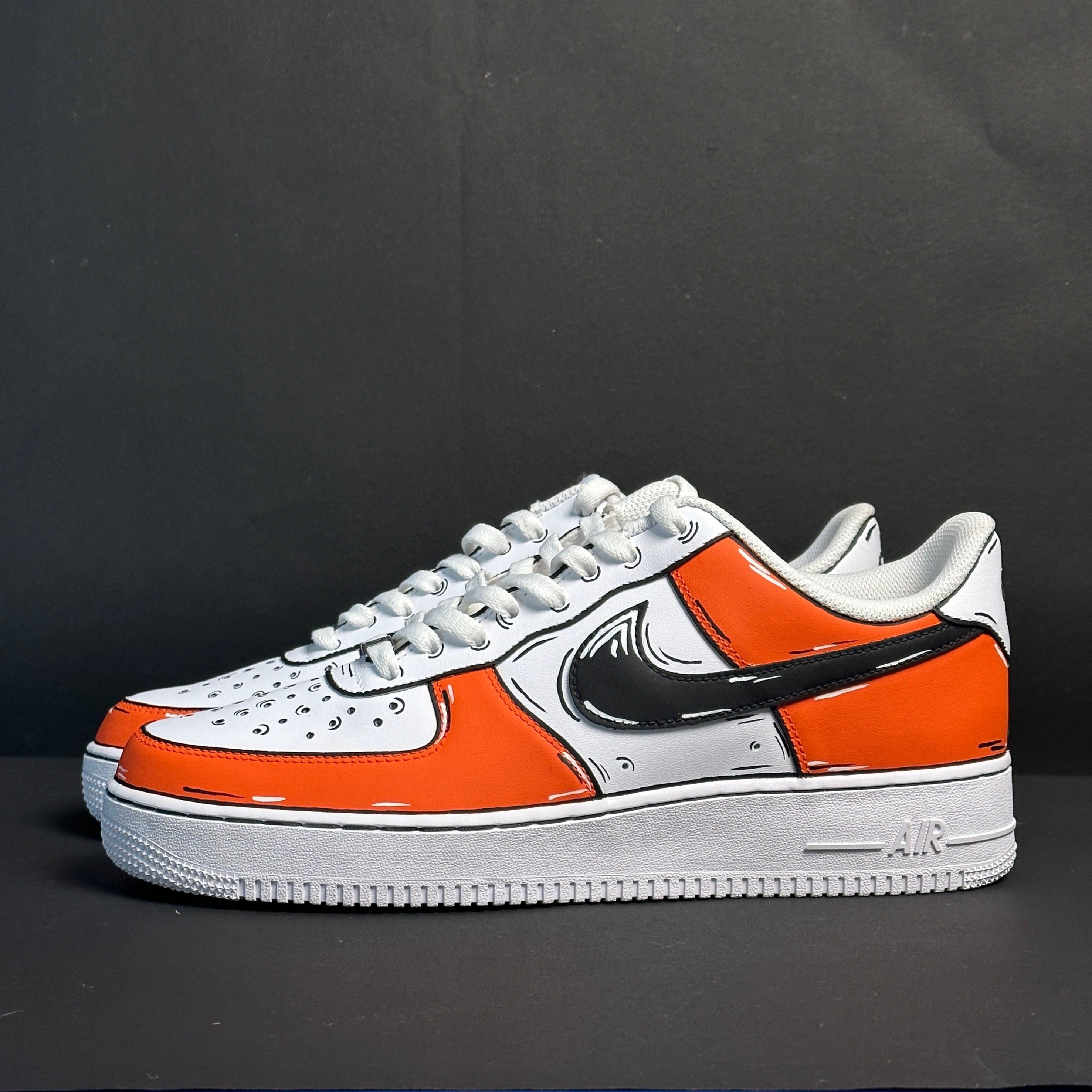 Custom white and orange Nike Air Force 1 sneaker with bold black cartoon-style outlines, side view