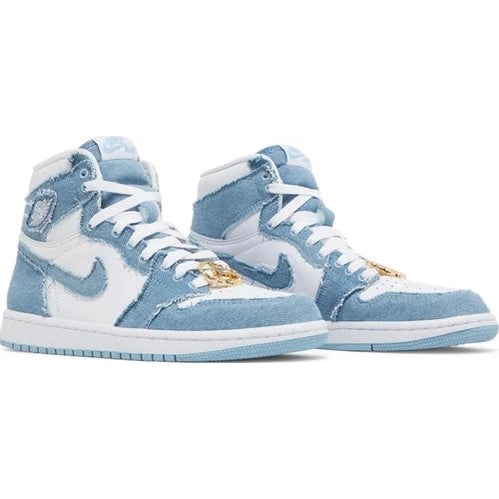 Light blue and white high-top sneakers with suede overlays and gold lace accessory