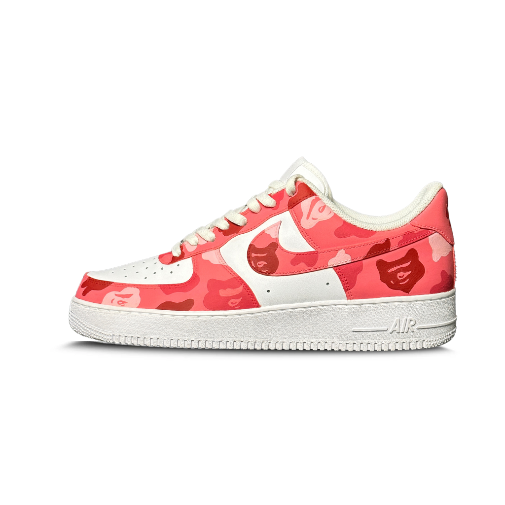 White and pink camo low-top sneaker with graphic print and white sole on white background