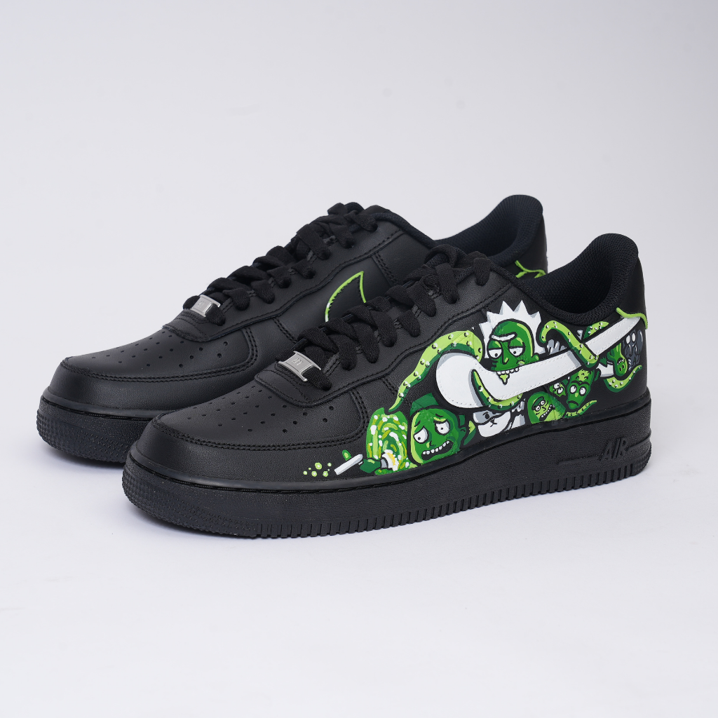 Black custom leather sneakers with green and white cartoon graphic, streetwear style