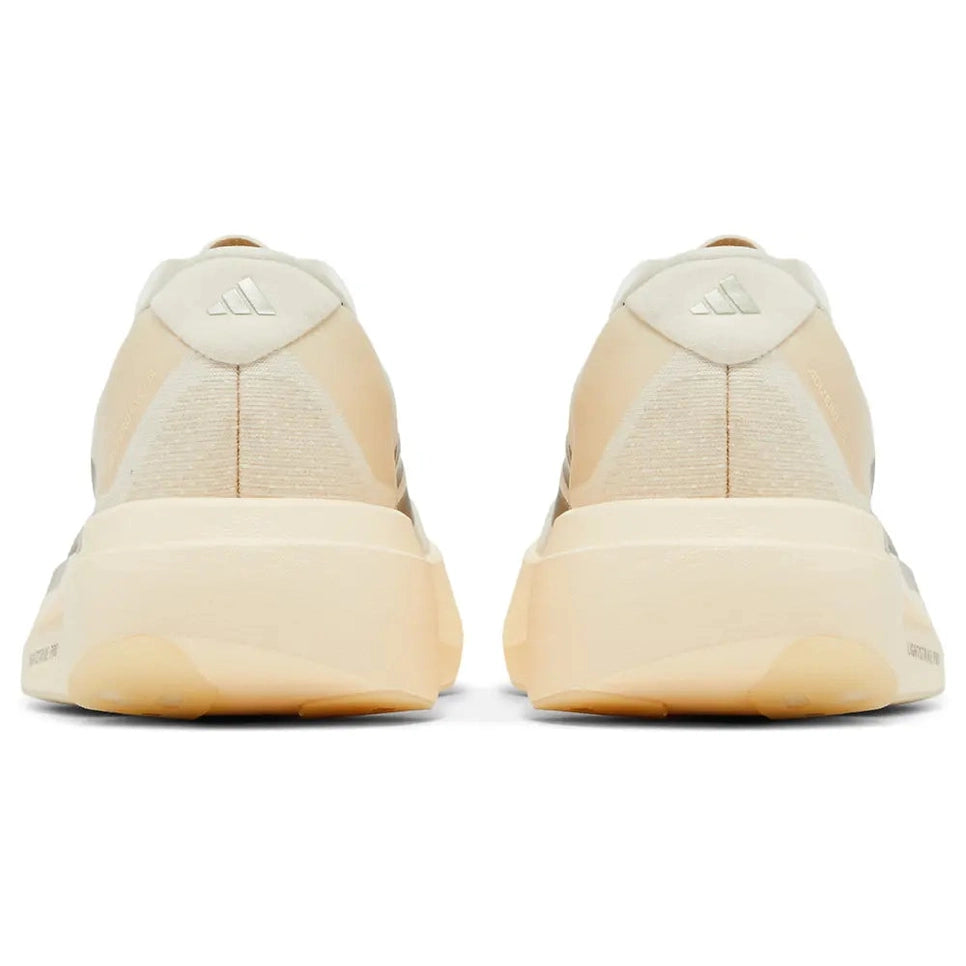 Back view of beige and cream Adidas sneakers with cushioned soles, streetwear footwear