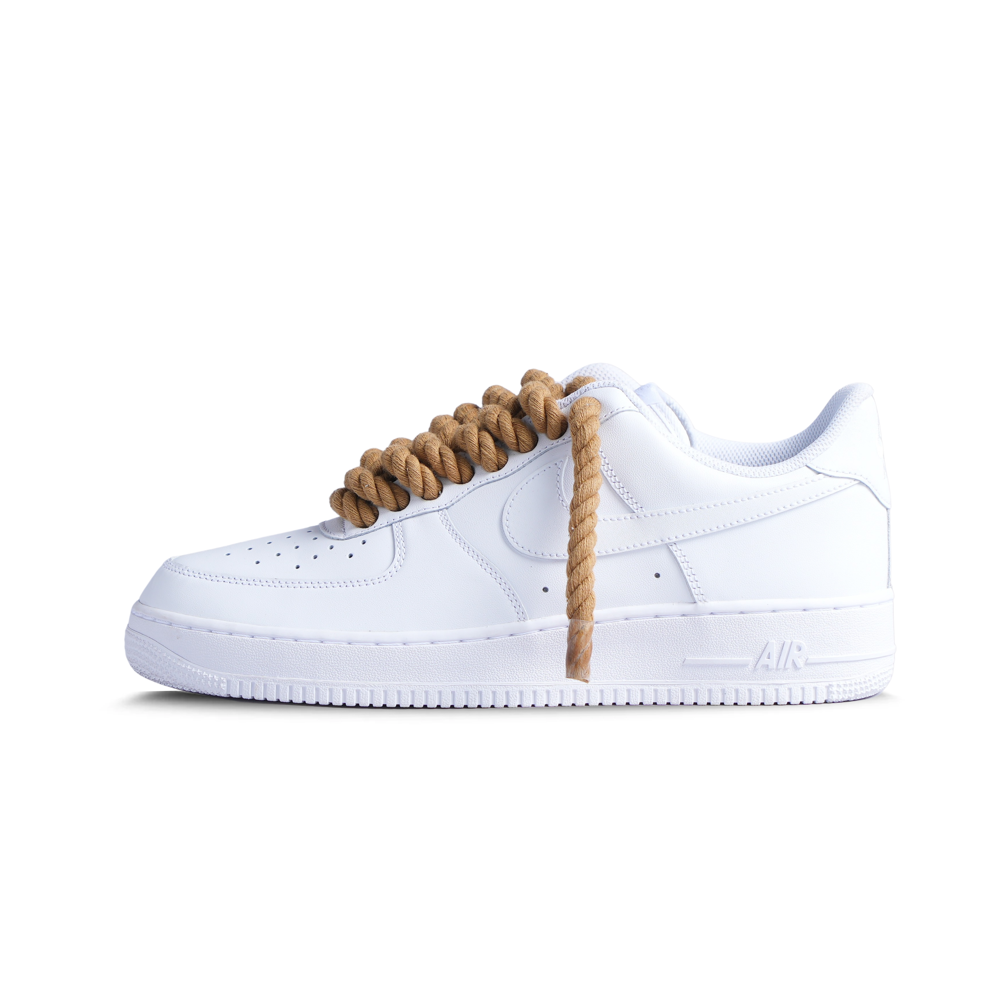 White low-top sneaker with thick brown rope laces, streetwear style, isolated on white background