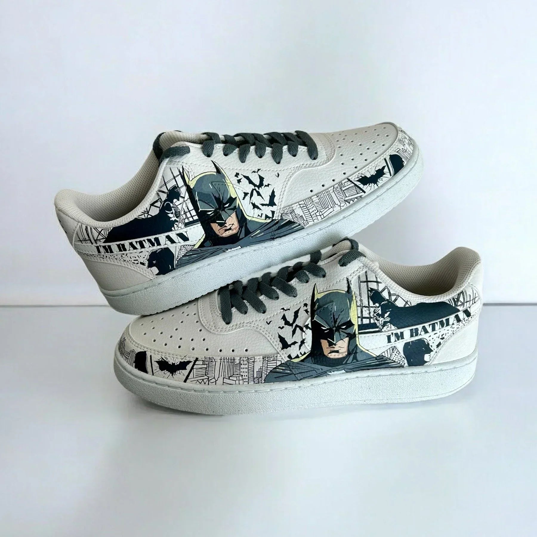 Custom white low-top sneakers with Batman graphic, bats, city skyline and 'I'm Batman' text