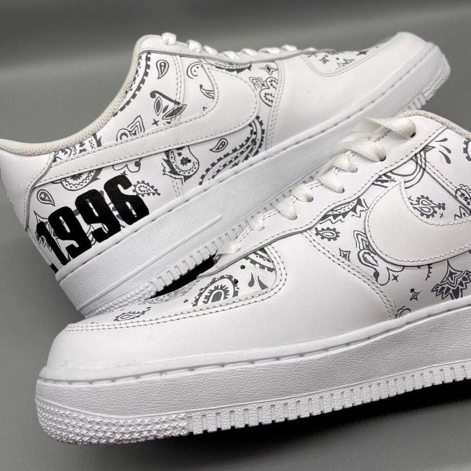 White custom Air Force 1 sneakers with black paisley pattern and '1996' text detail