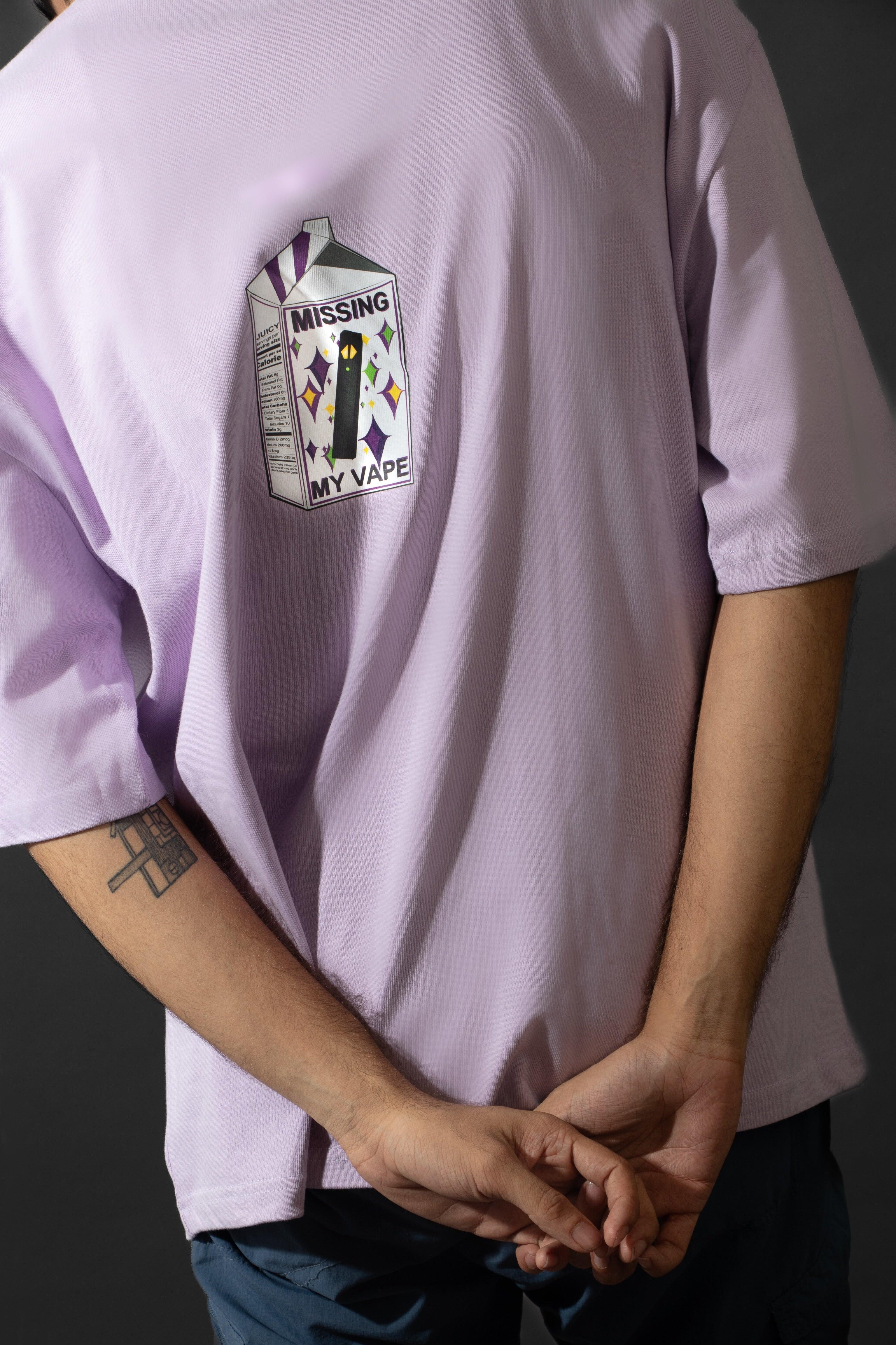 Back view of person wearing lavender streetwear t-shirt with 'Missing My Vape' cartoon print.