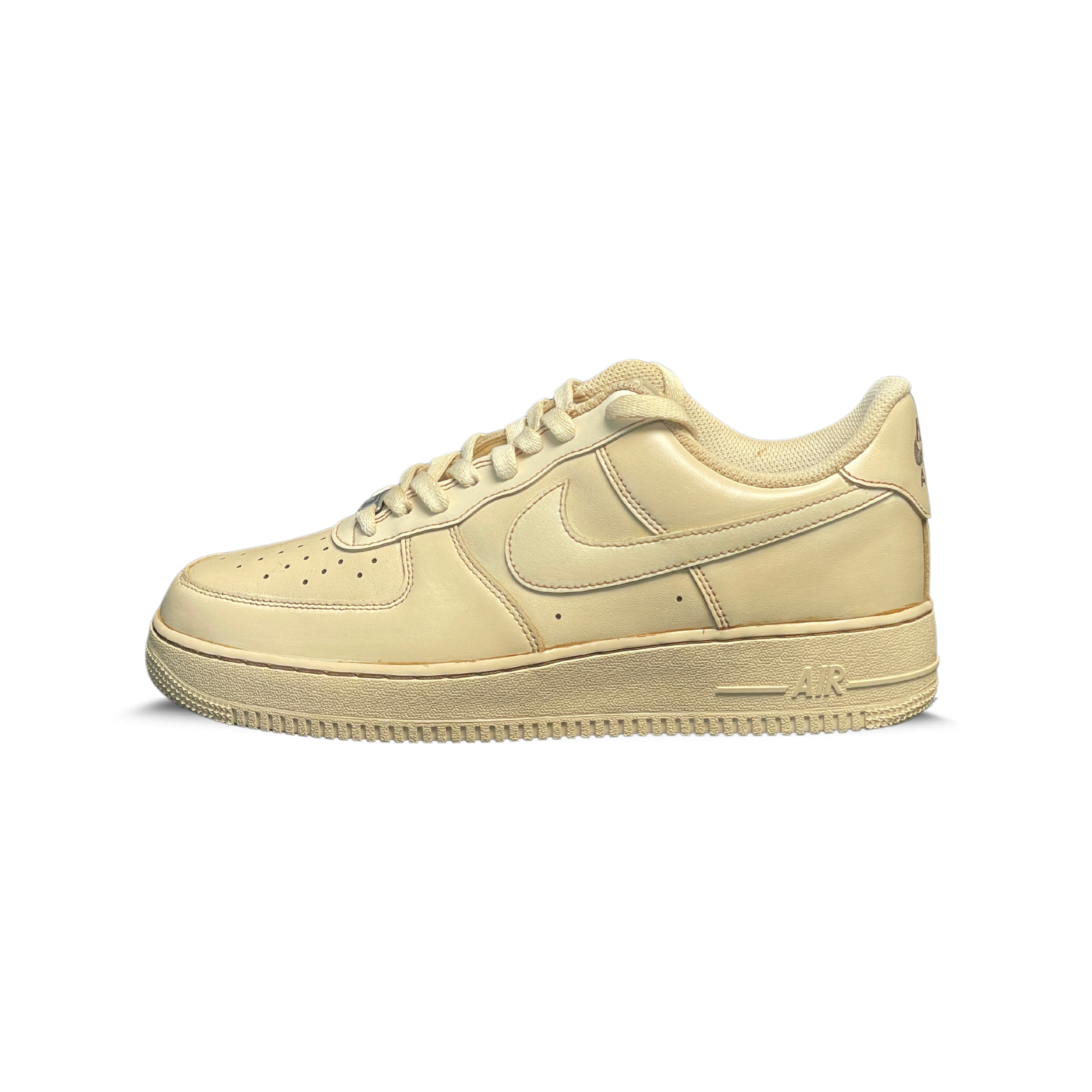 Beige low-top sneaker with side swoosh logo, perforated toe, and rubber sole on white background