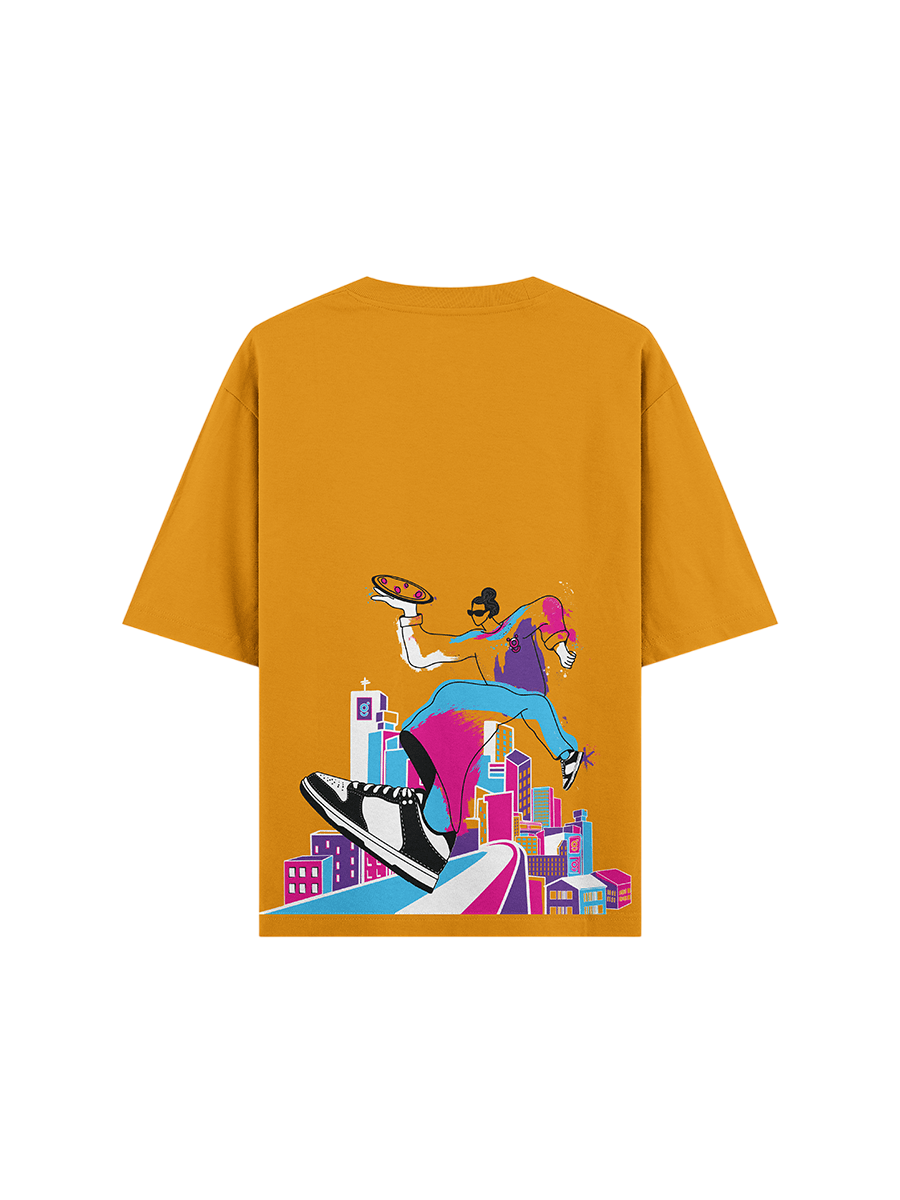 Mustard streetwear T-shirt with colorful graphic of skateboarding figure over city skyline